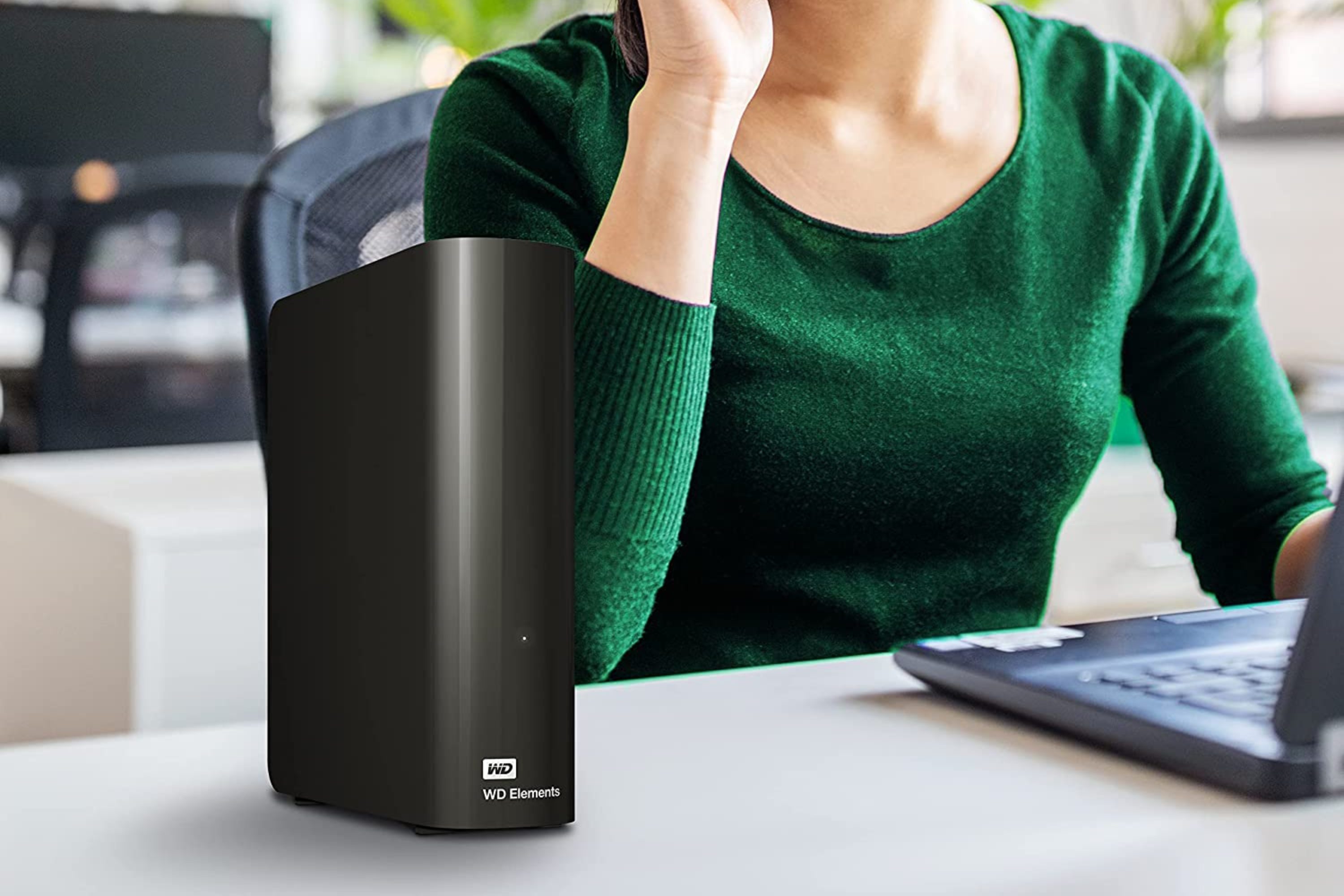WD external drive elements in front of person 