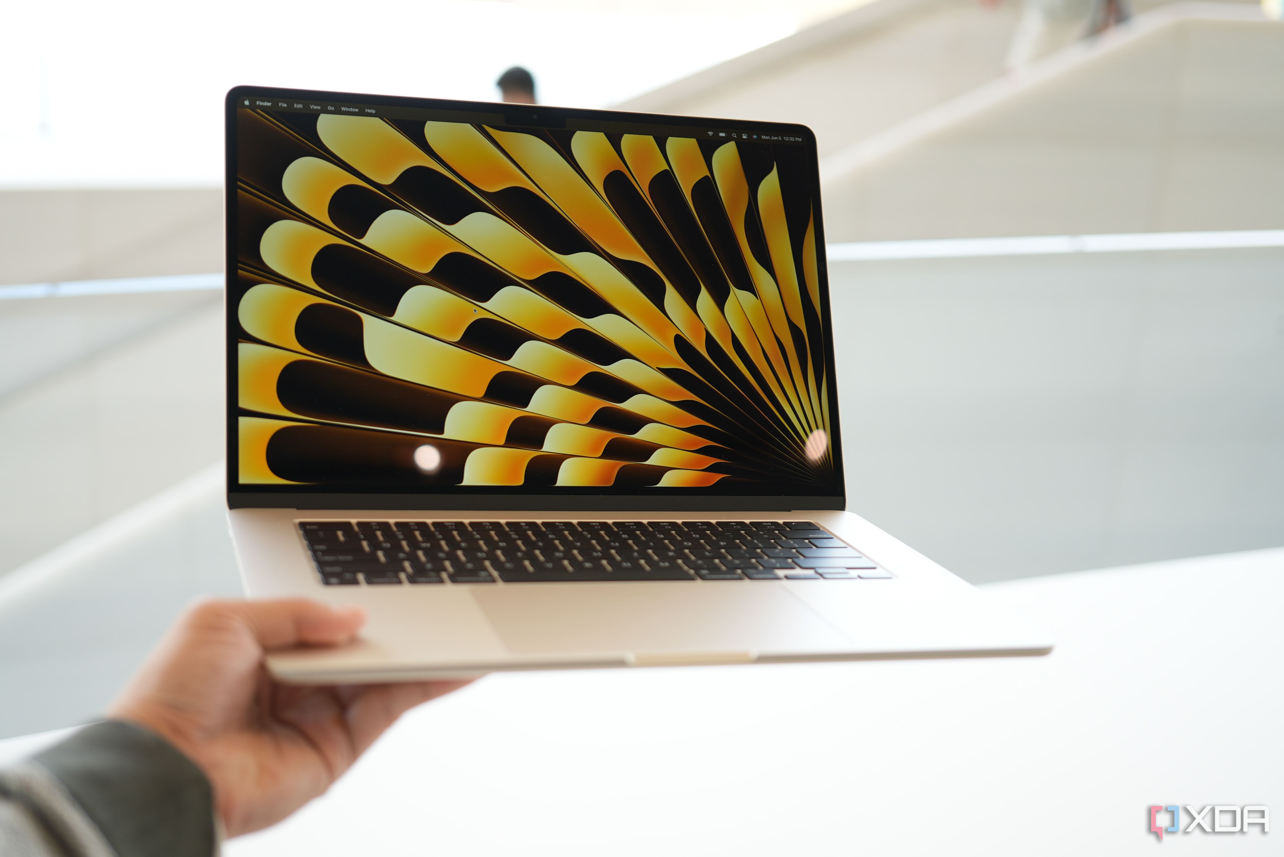 The 15-inch MacBook Air in the hand. 