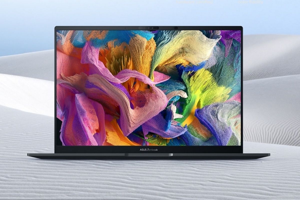 Asus Zenbook 14X OLED (2023) pictured in the background of a desert