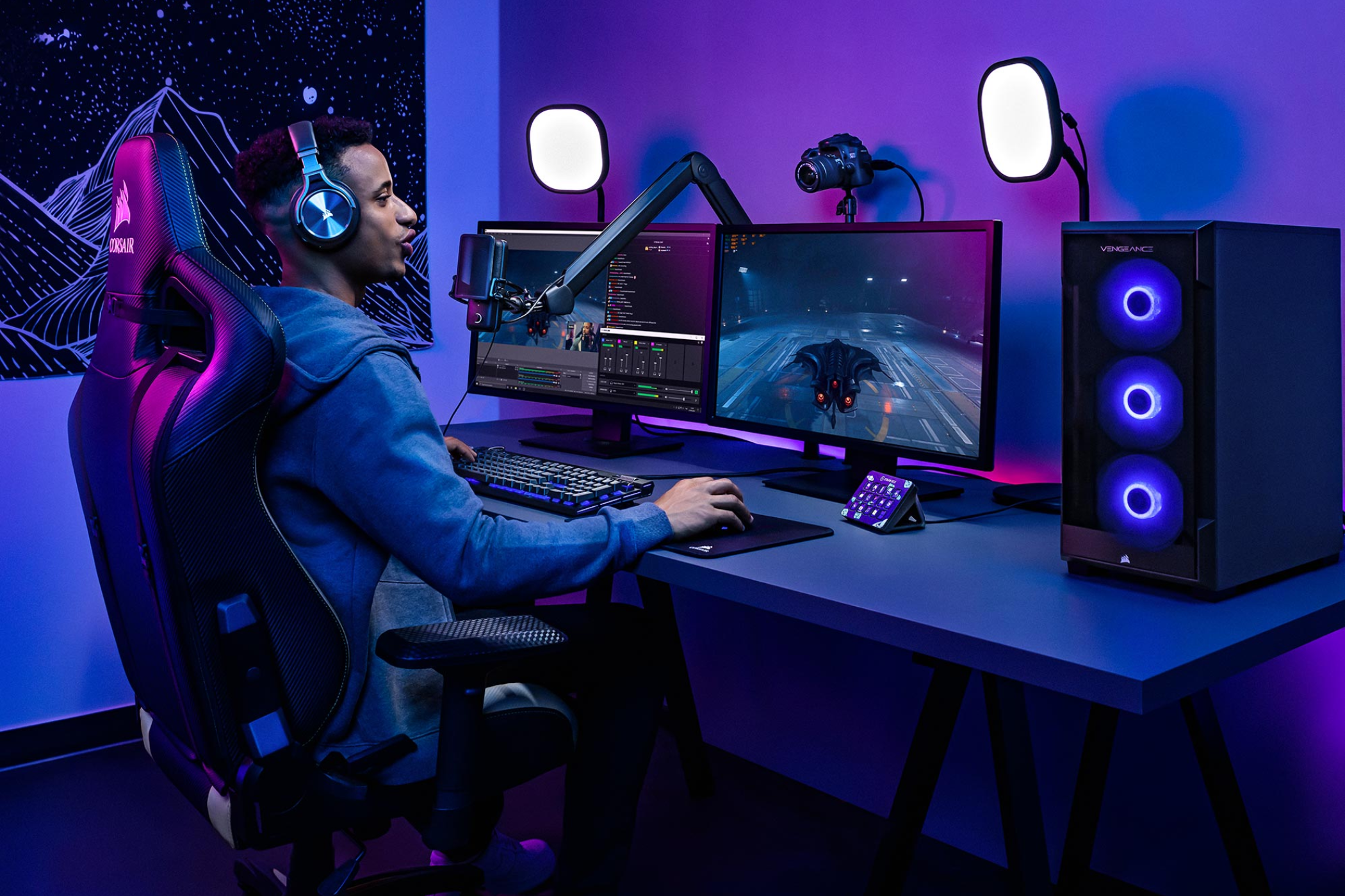 Person playing games on a PC while using Elgato streaming accessories.