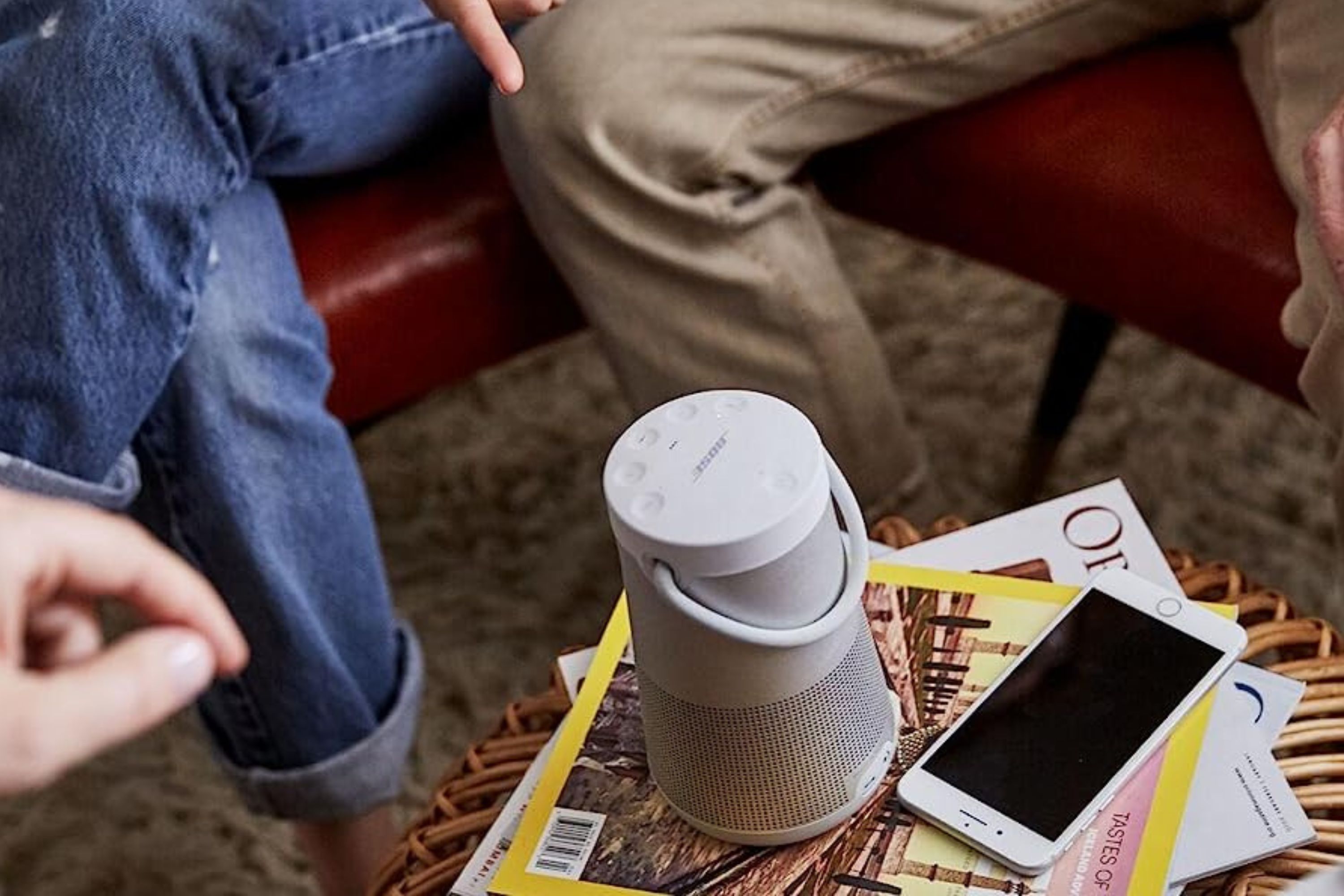 Bose SoundLink Revolve+ ii Bluetooth Speaker on table next to phone 