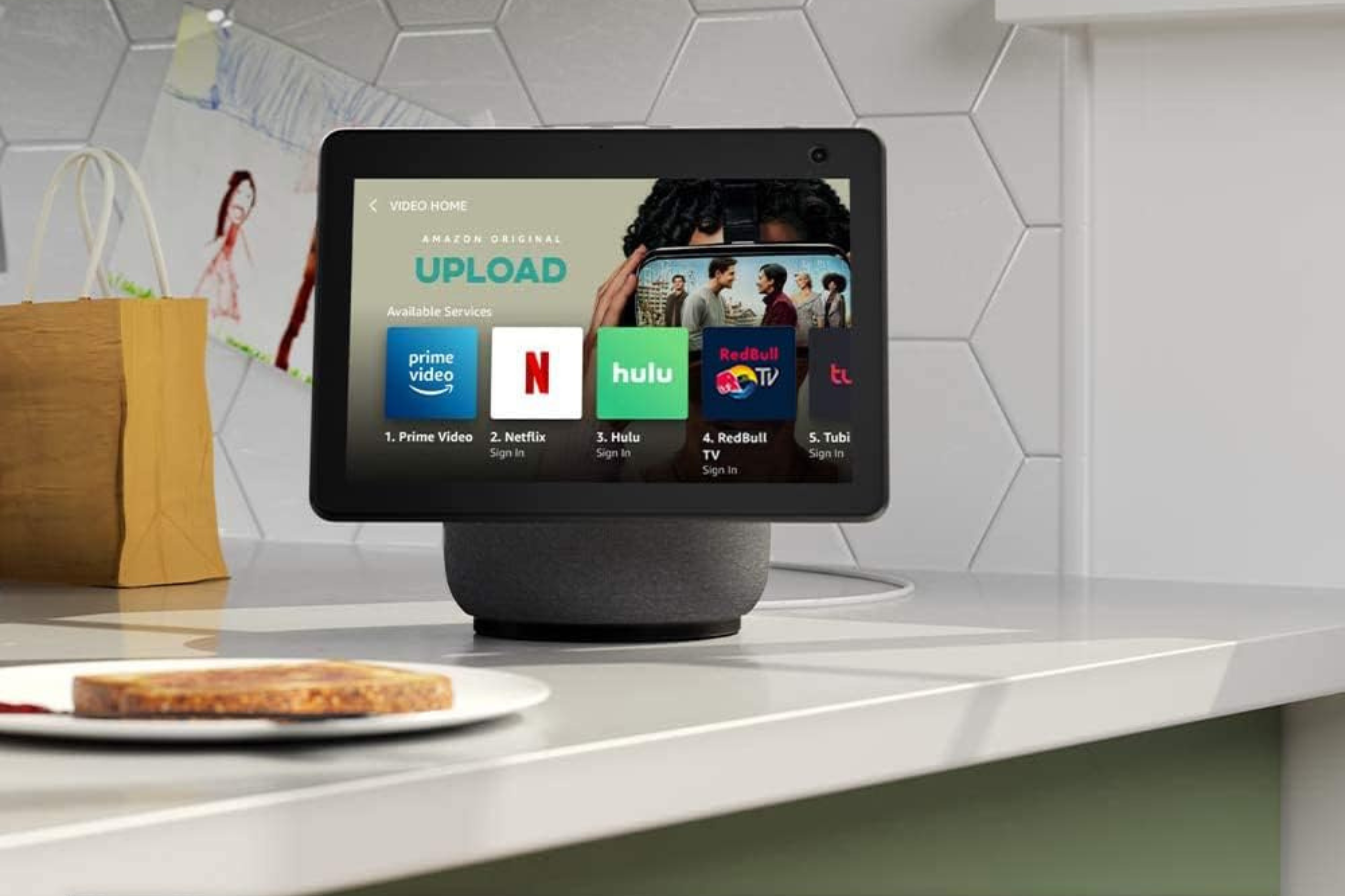 Echo Show 10 (3rd Gen)  in the kitchen next to a piece of toast