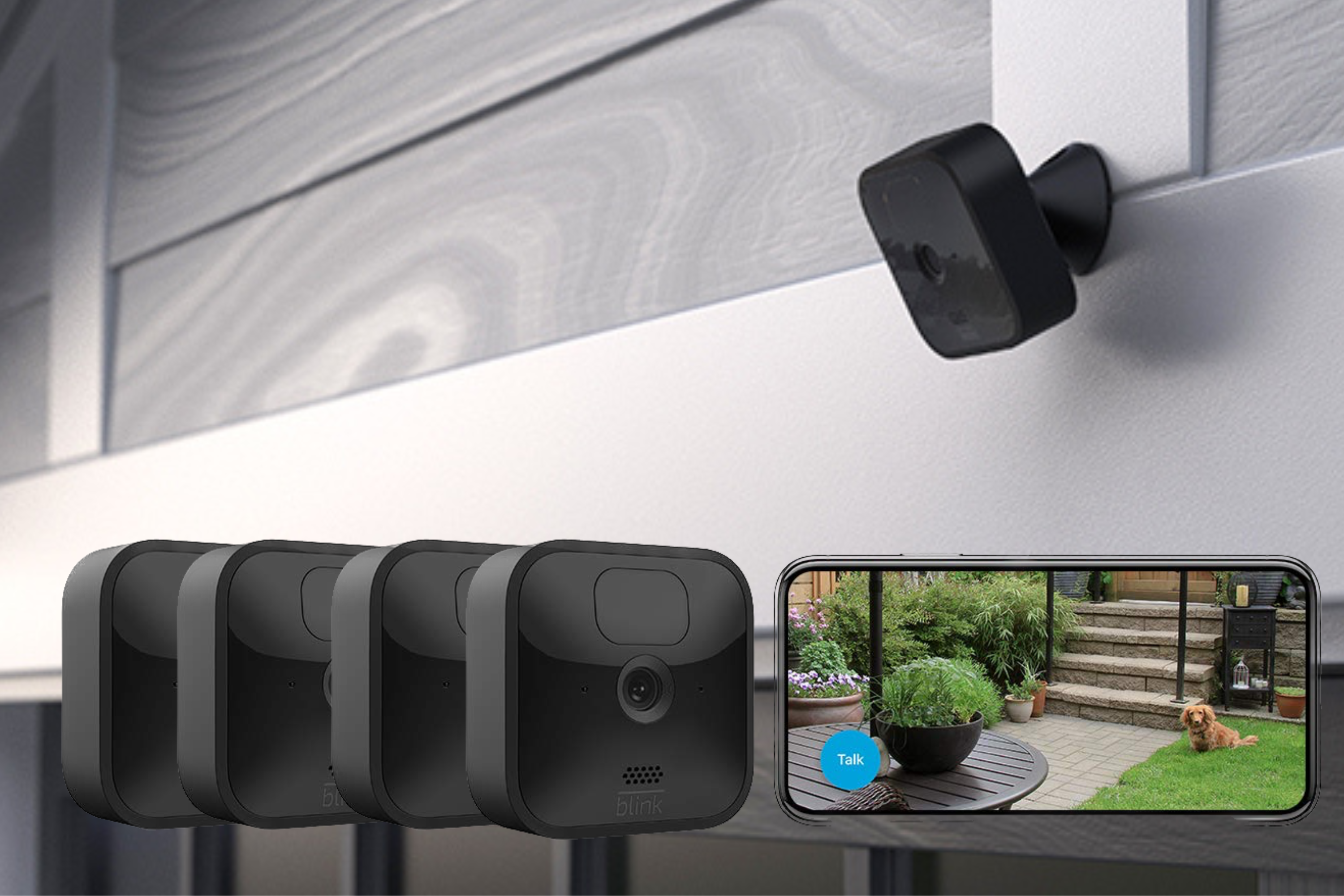 Blink Outdoor (3rd Gen) wireless camera system with phone showing picture of a dog