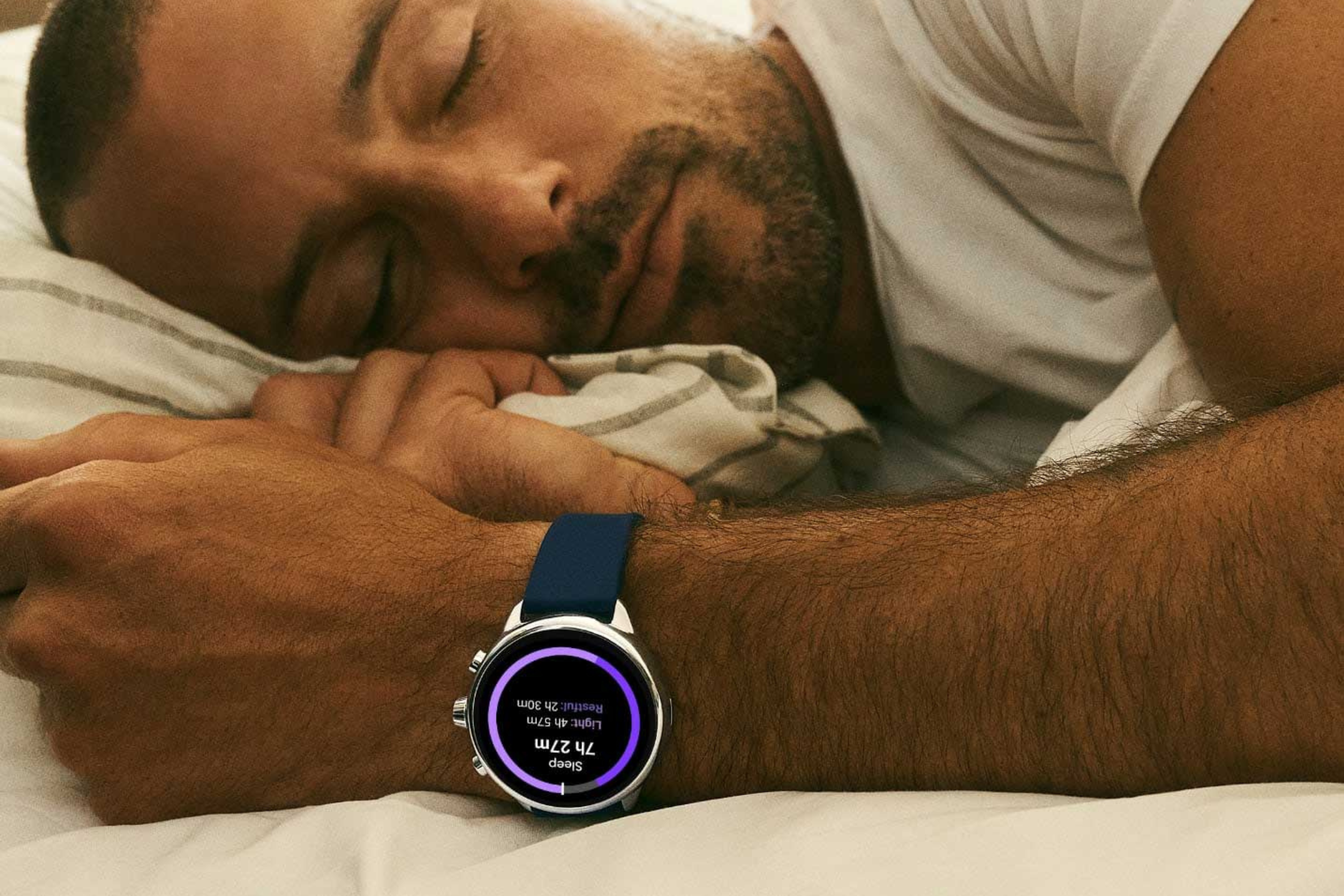 A person sleeping with the Fossil Gen 6 Wellness Edition 