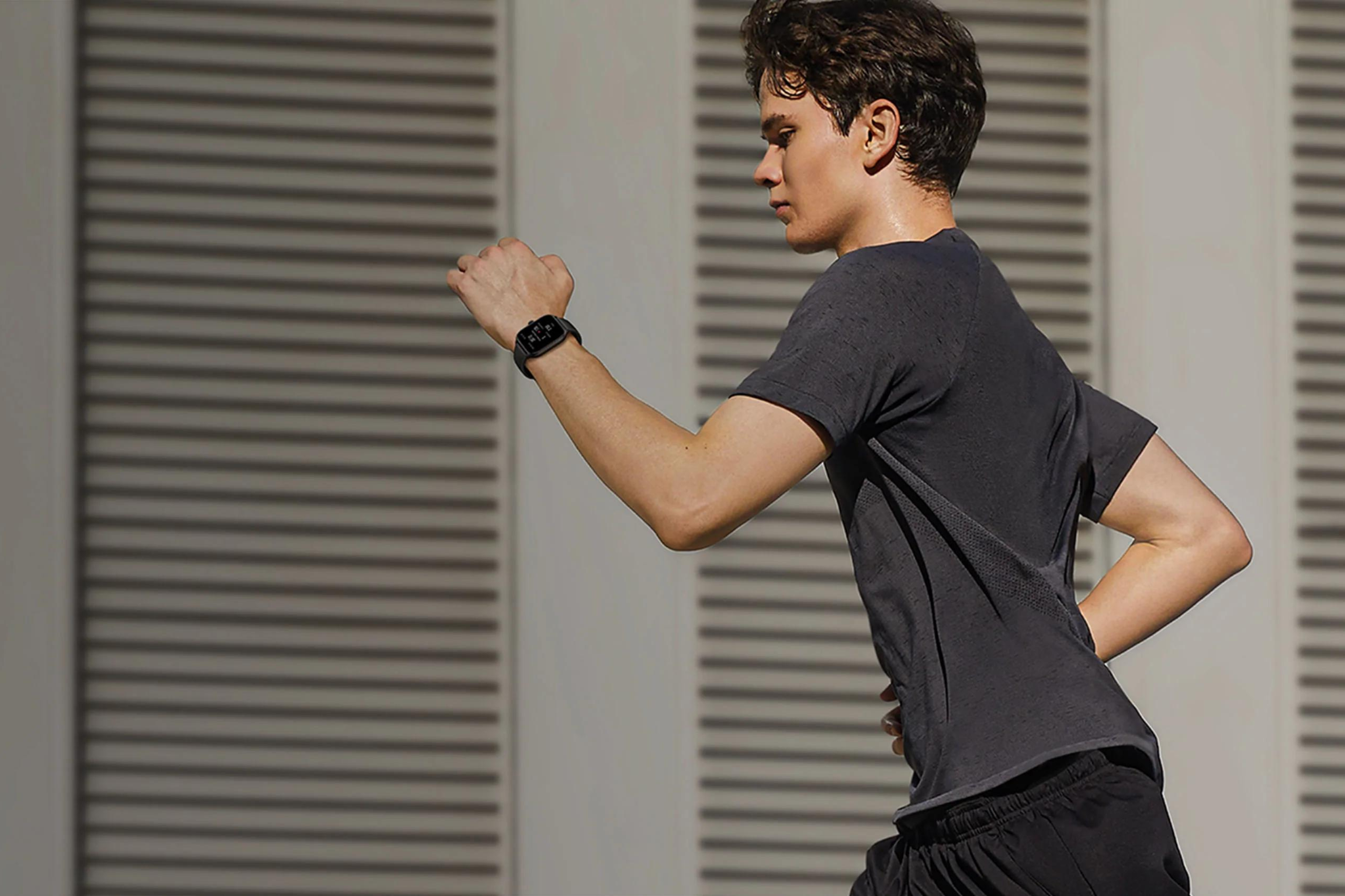 Amazfit GTS 4 Smart Watch on a person running with great concentration