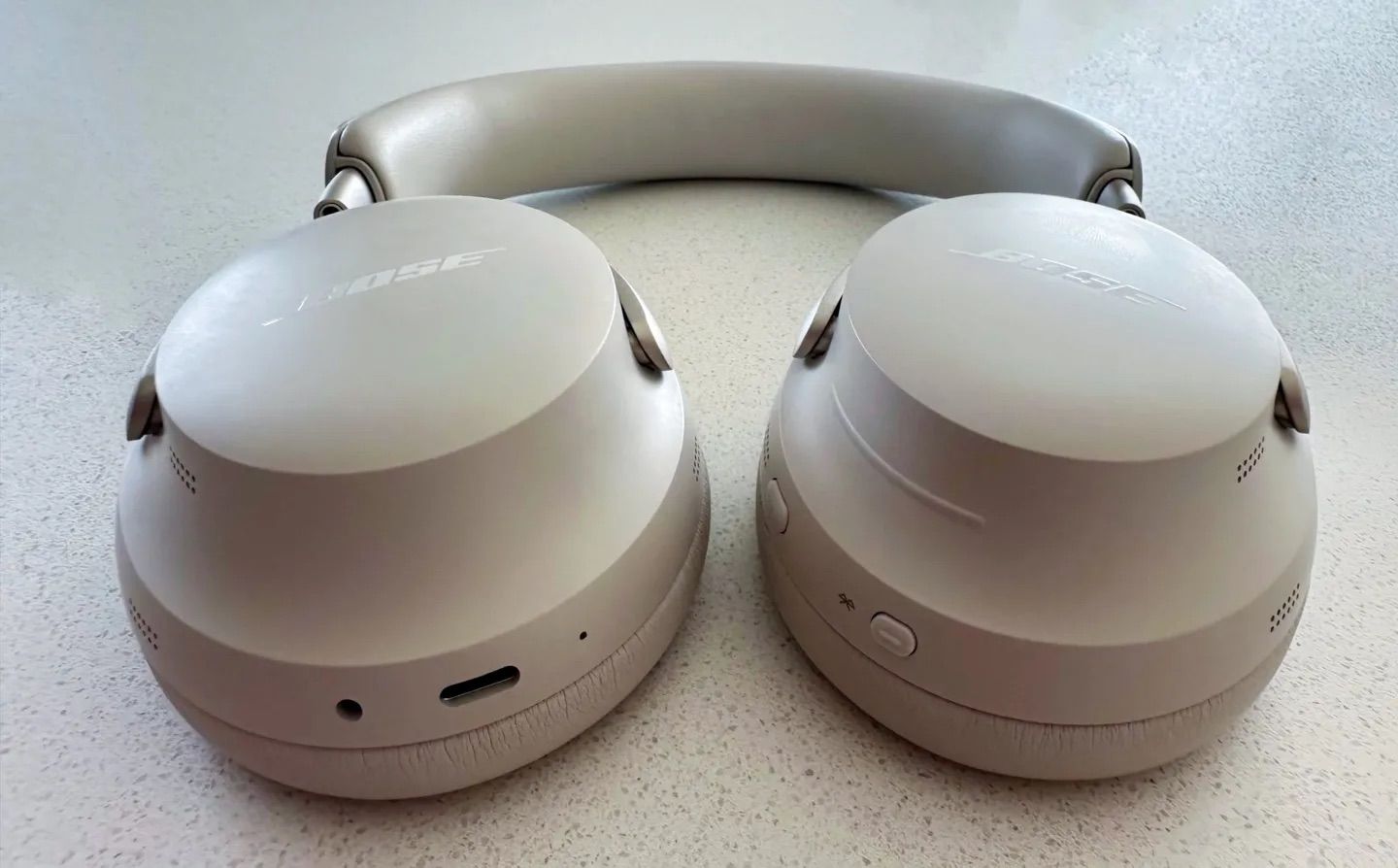Bose QuietComfort Ultra headphones earcups, USB-C port, and volume slider