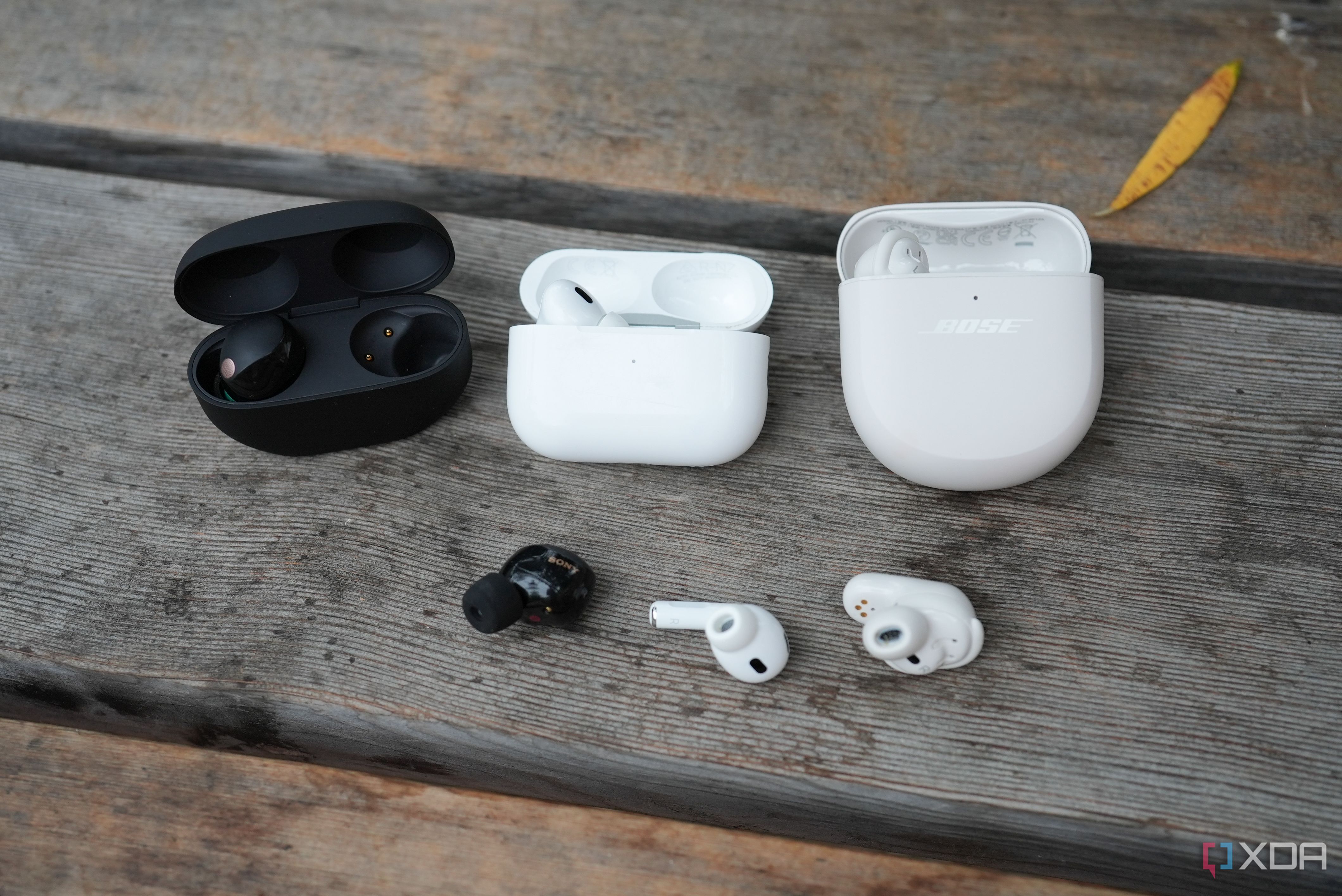 The Sony WF-1000XM5 (left) and the AirPods Pro (middle) and Bose QC Earbuds 2 (right)