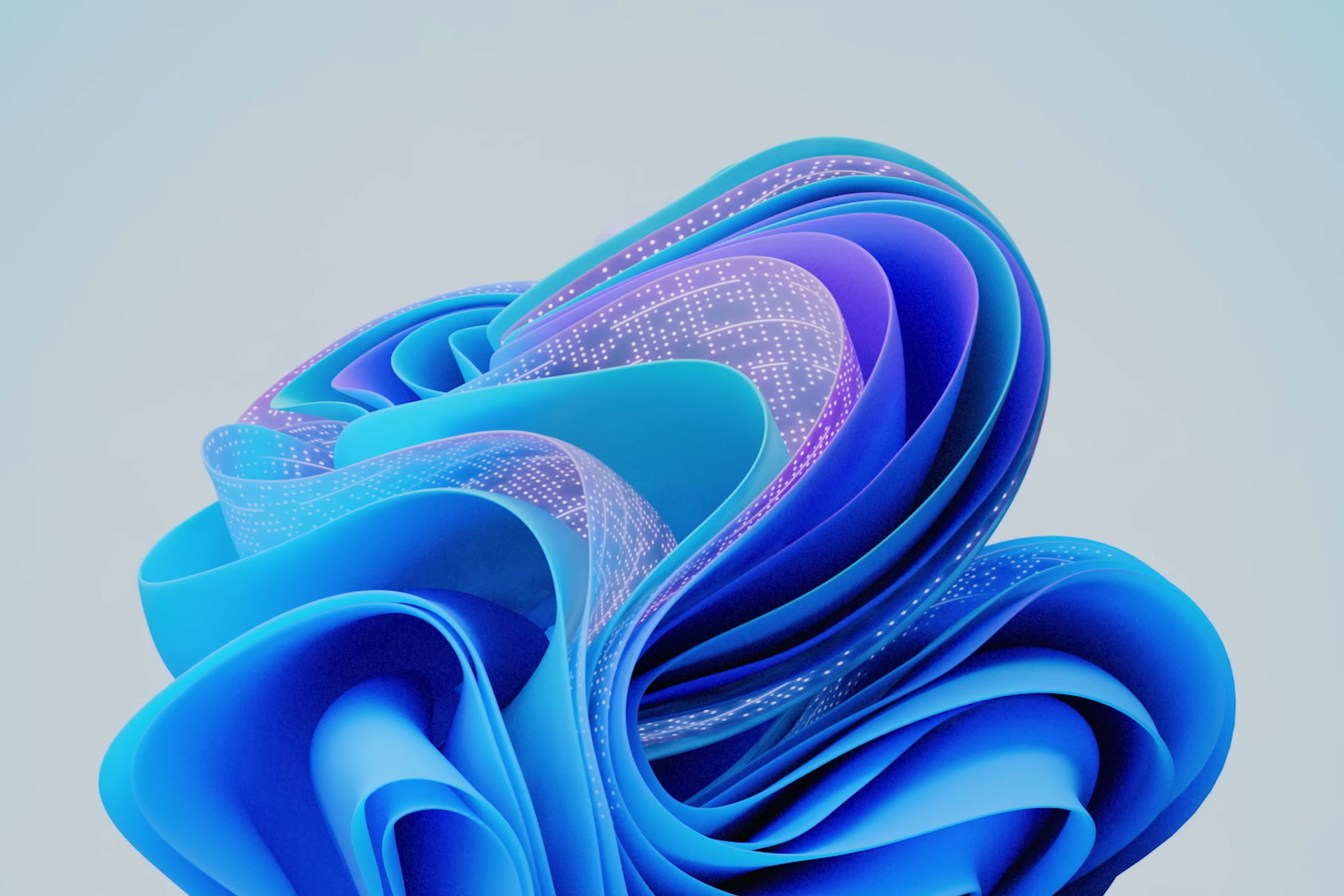 The default Windows 11 Bloom wallpaper with wavy blue shapes, but some are colored purple and show white dots to symbolize artificial intelligence