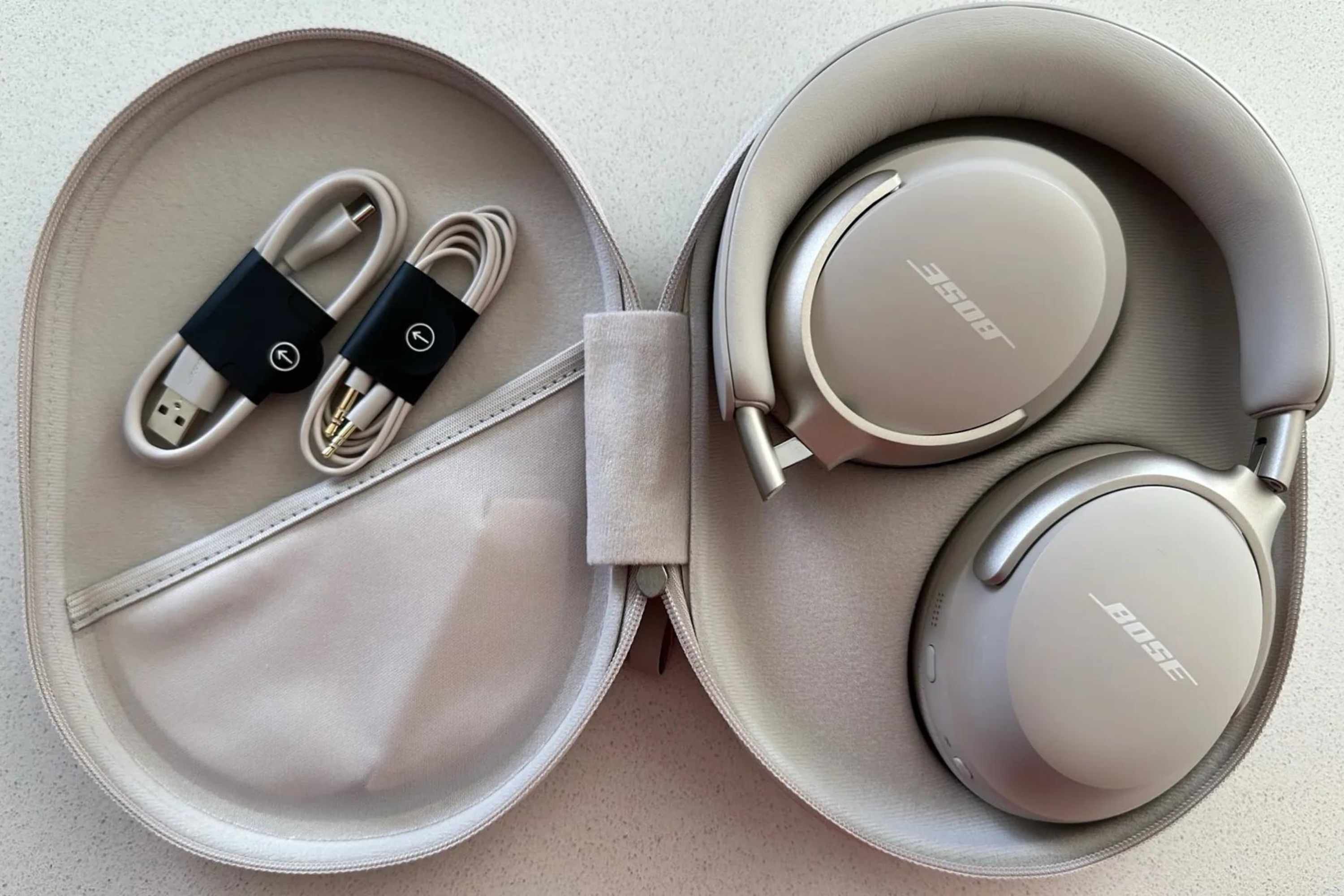 Bose QuietComfort Ultra headphones in cream with case and accessories