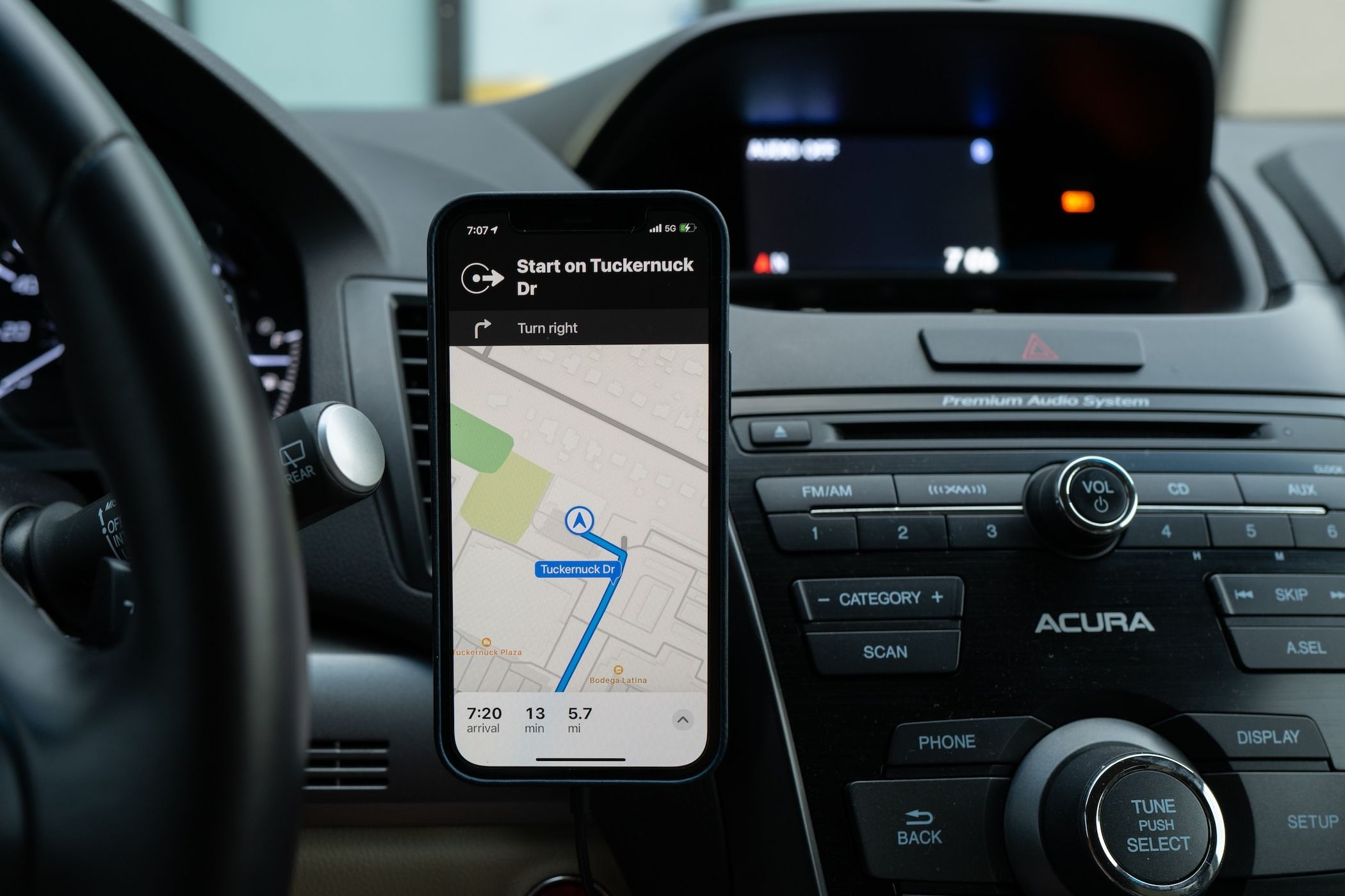 Apple Maps navigation on iPhone on a car dashboard