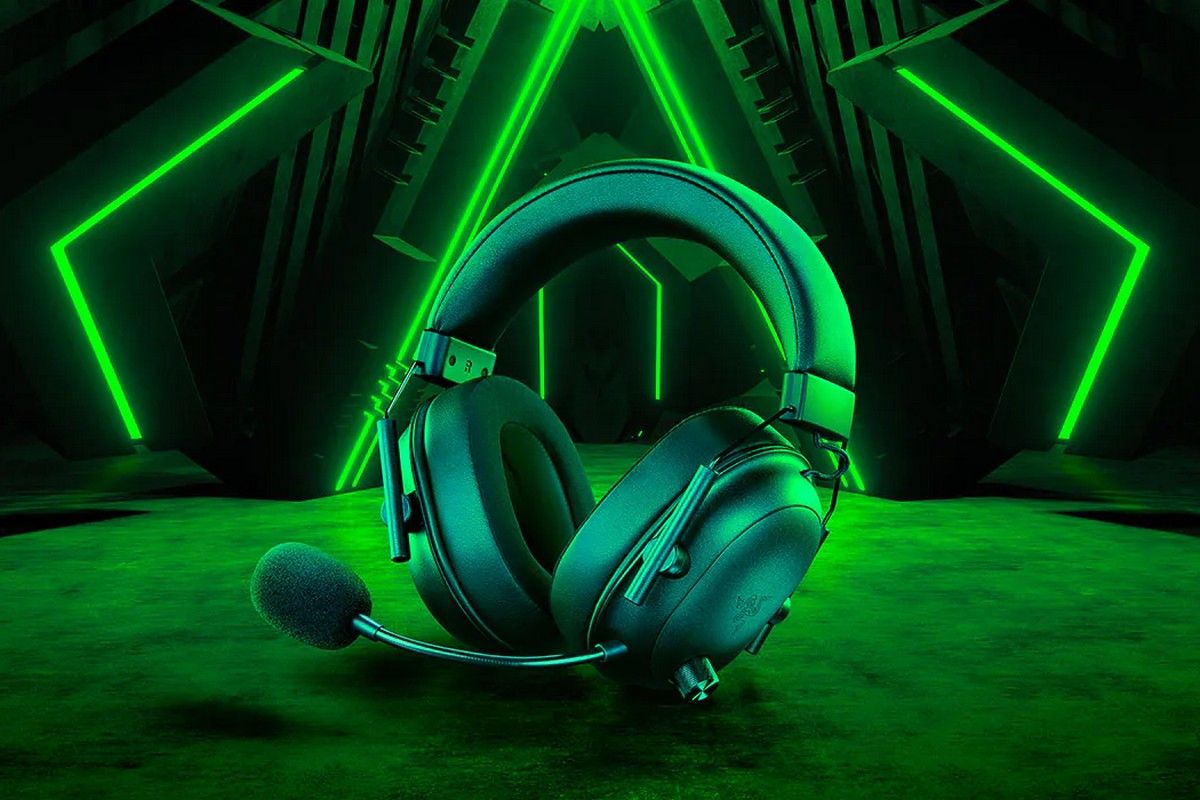 Razer BlackShark V2 HyperSpeed gaming headset with green neon lights in the background