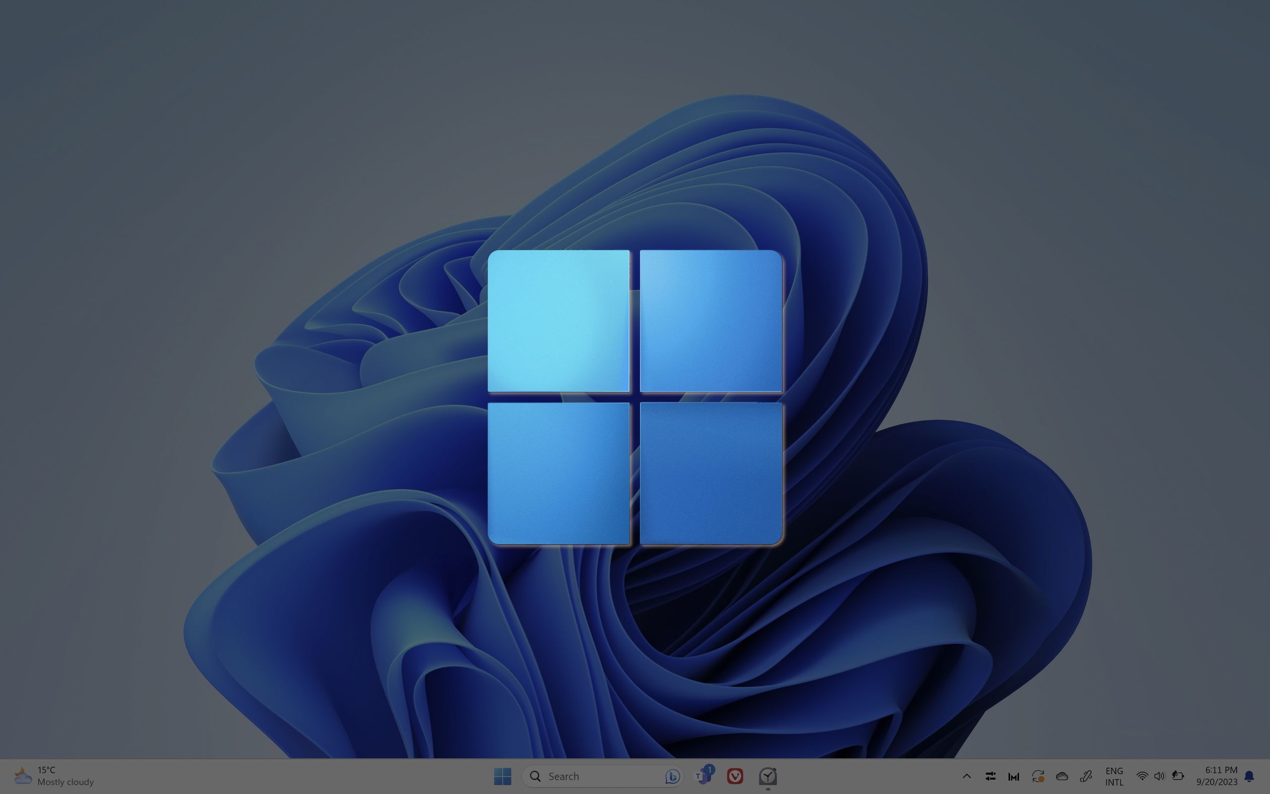 A screenshot of the Windows 11 Bloom wallpaper with the Windows 11 Start menu icon laid on top