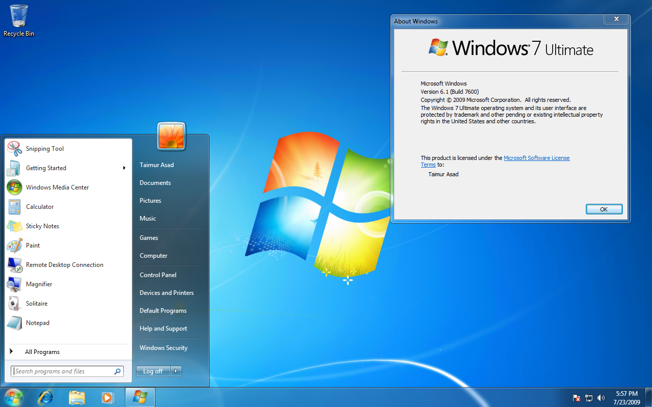 Screenshot of Windows 7 displaying the About Windows window and the Start menu