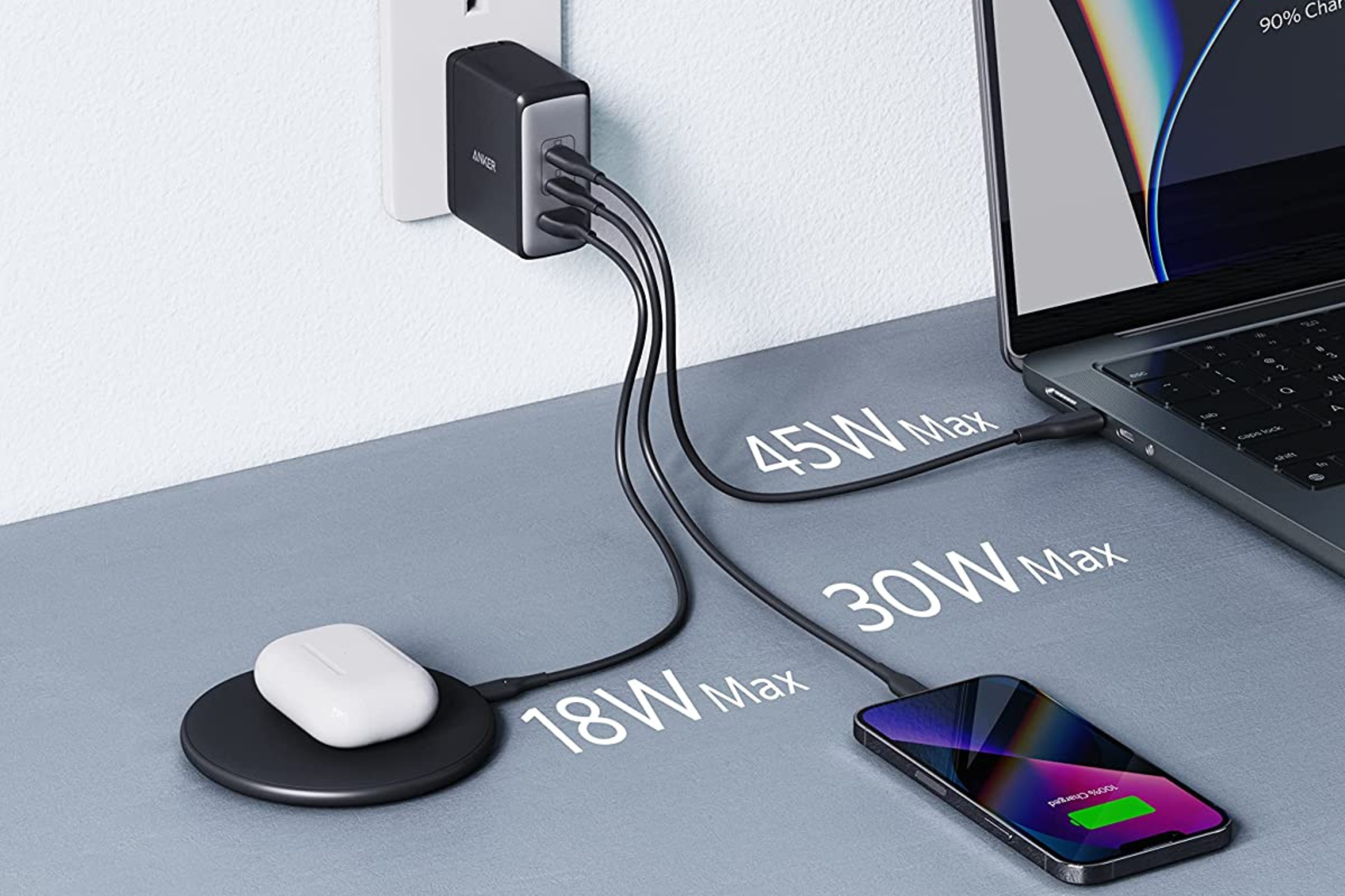 Anker USB C Charger with airpos, iphone, and macbook plugged in