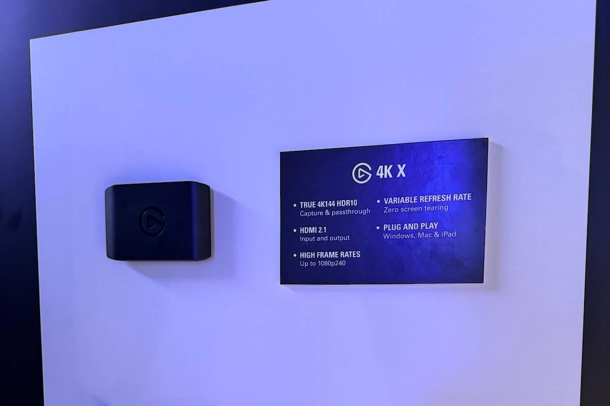 Elgato capture card 4K X mounted on a wall next to a board listing its key specifications