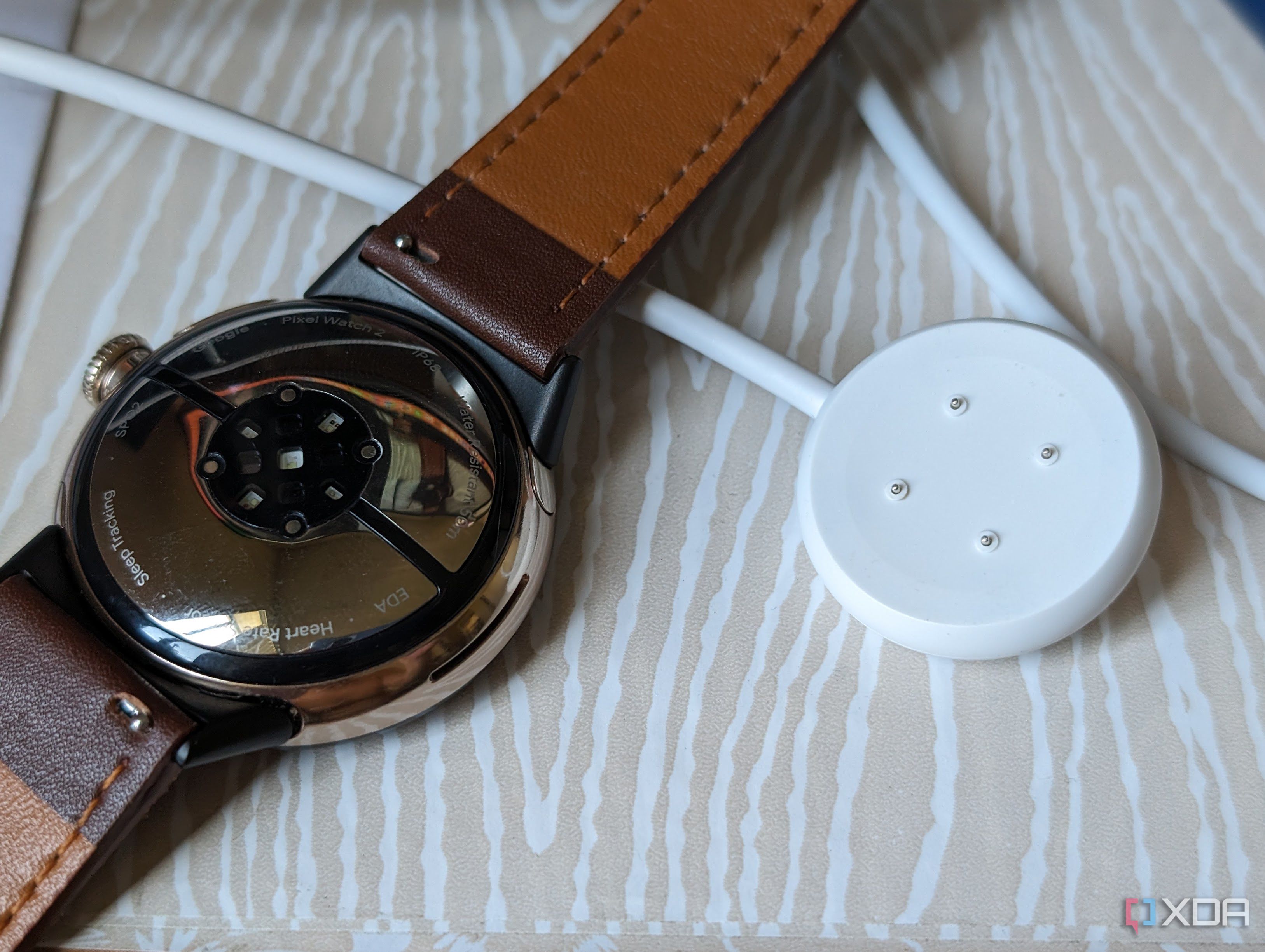 The Pixel Watch 2 and its new charger.