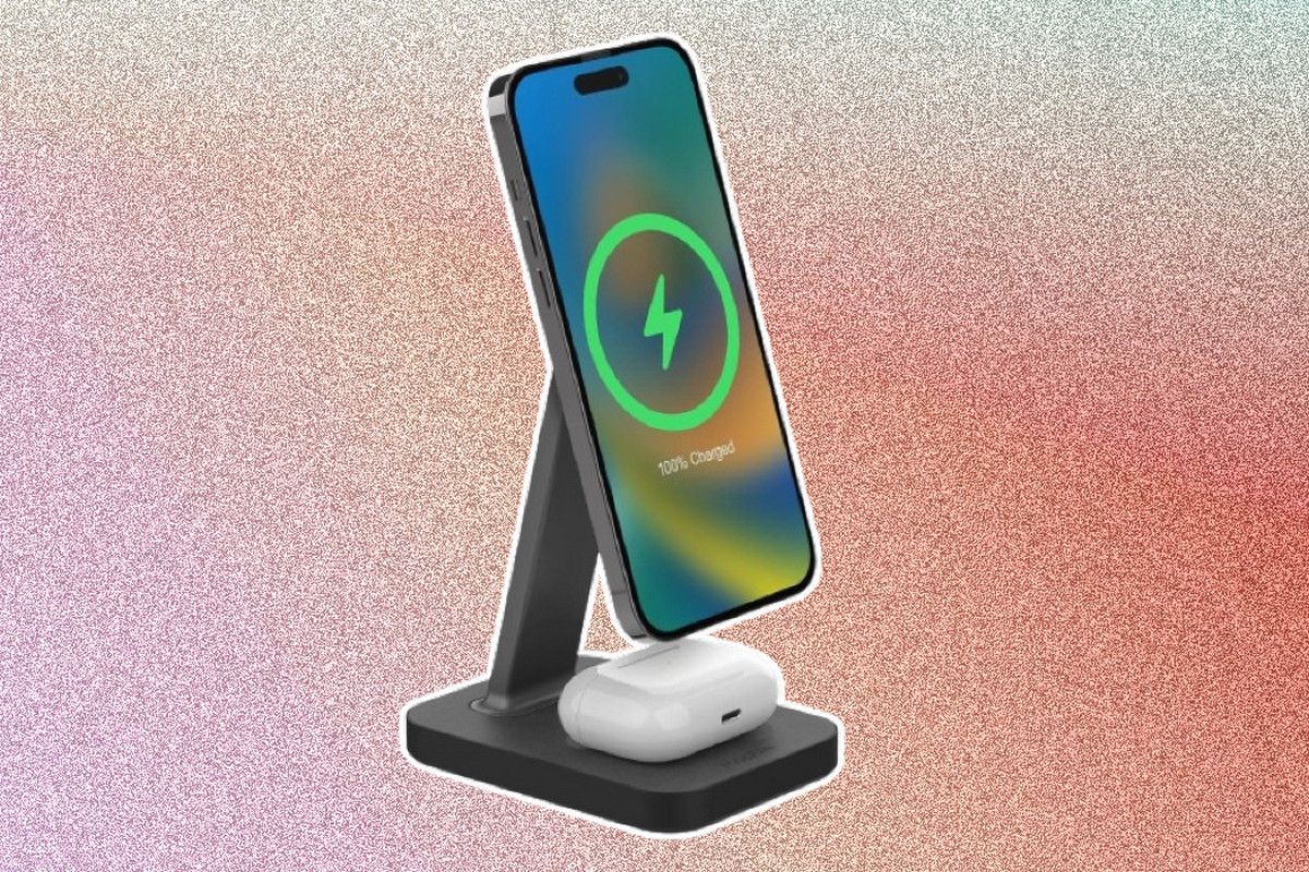 A wireless charging stand holding an iPhone while an AirPods case is seen on the bottom charging pad