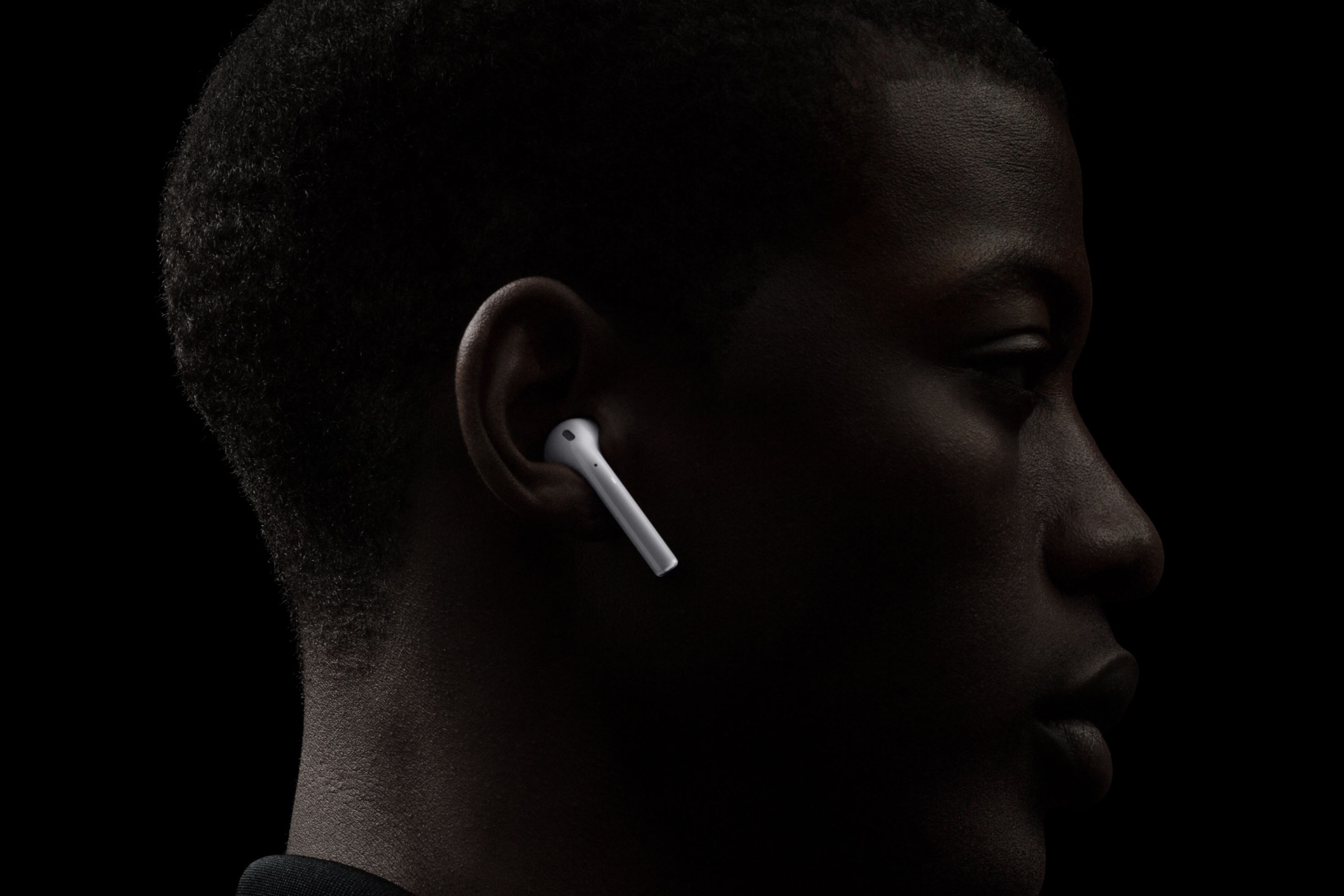 Person using Apple AirPods 2