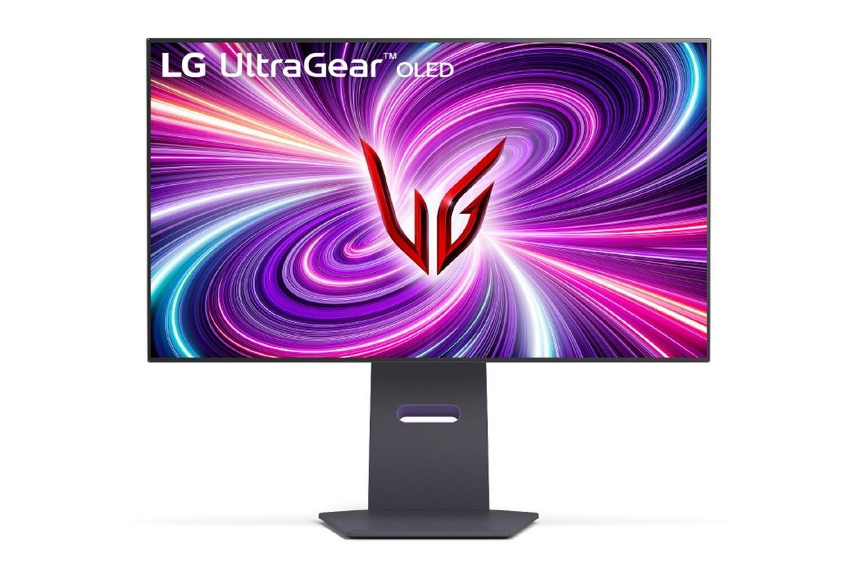 A monitor with a stylized red LG logo on a multi-colored psychedelic pattern