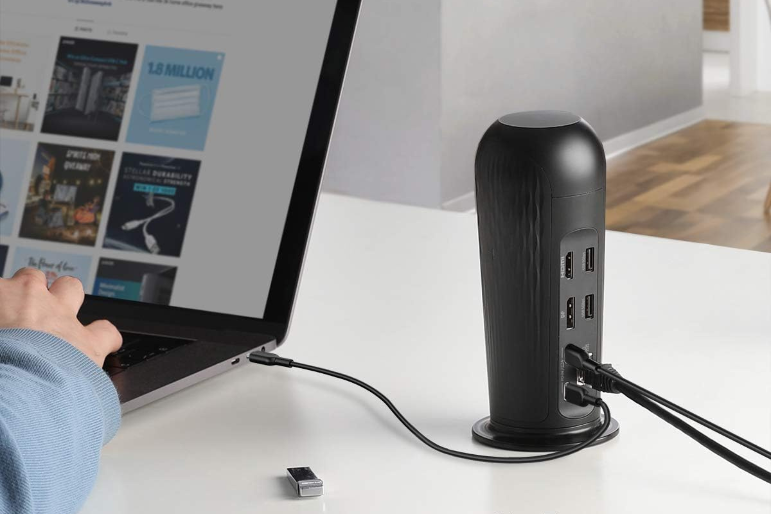Anker PowerExpand 12-in-1 USB-C PD Docking Station on a desk next to a laptop