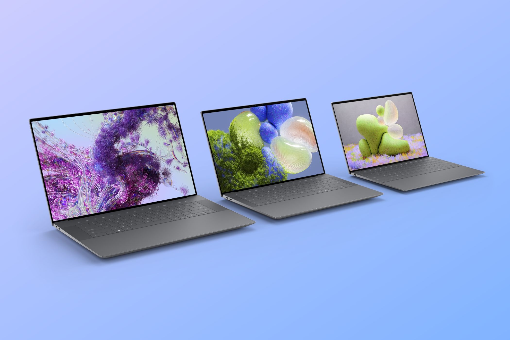 The Dell XPS family in Graphite over a blue gradient background