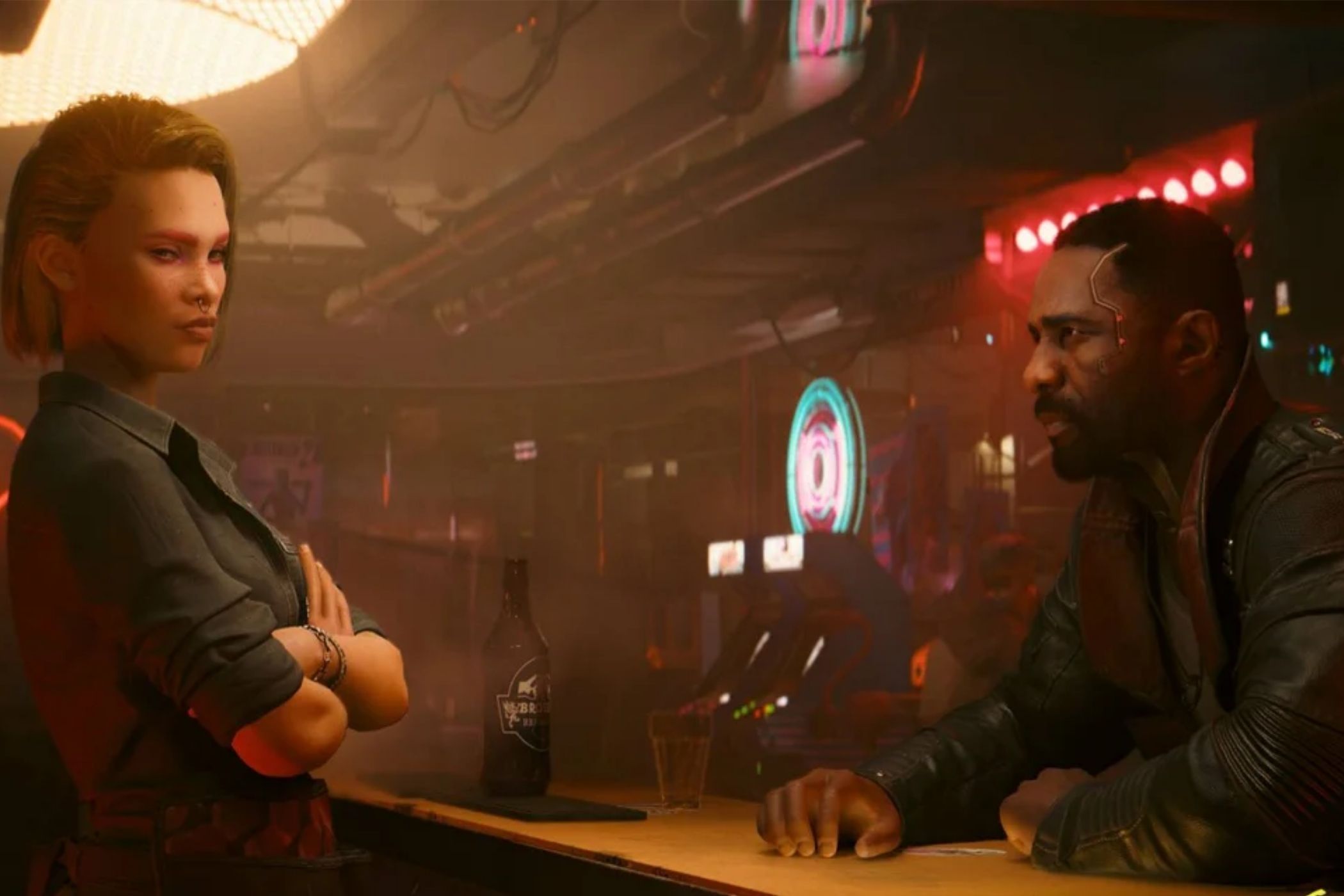 An image showing a screenshot of Cyberpunk 2077 phantom liberty gameplay with two people sitting at a bar.