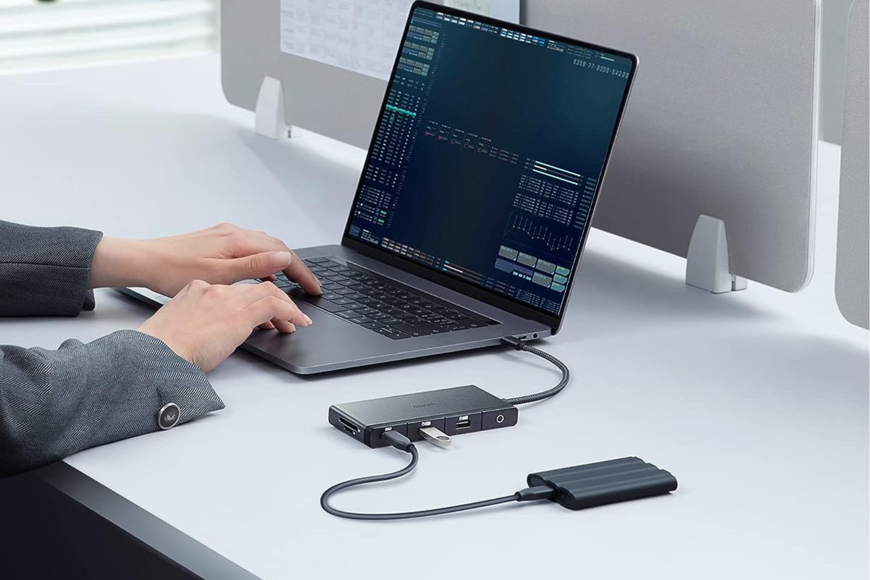 Anker 552 USB C Hub plugged into laptop with SSD and USB drive 