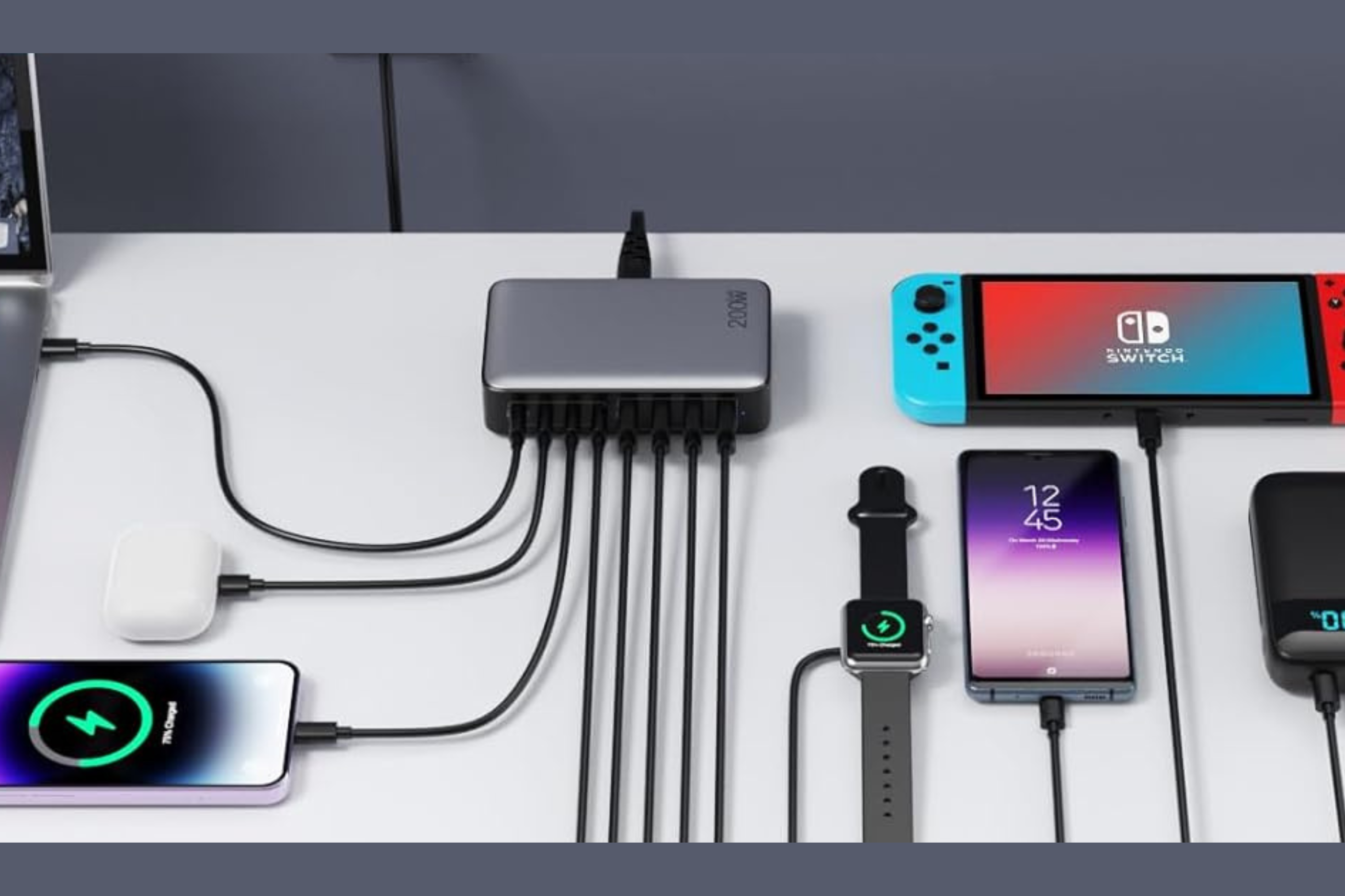 Anker 200W 8 port charging station plugged into many different devices