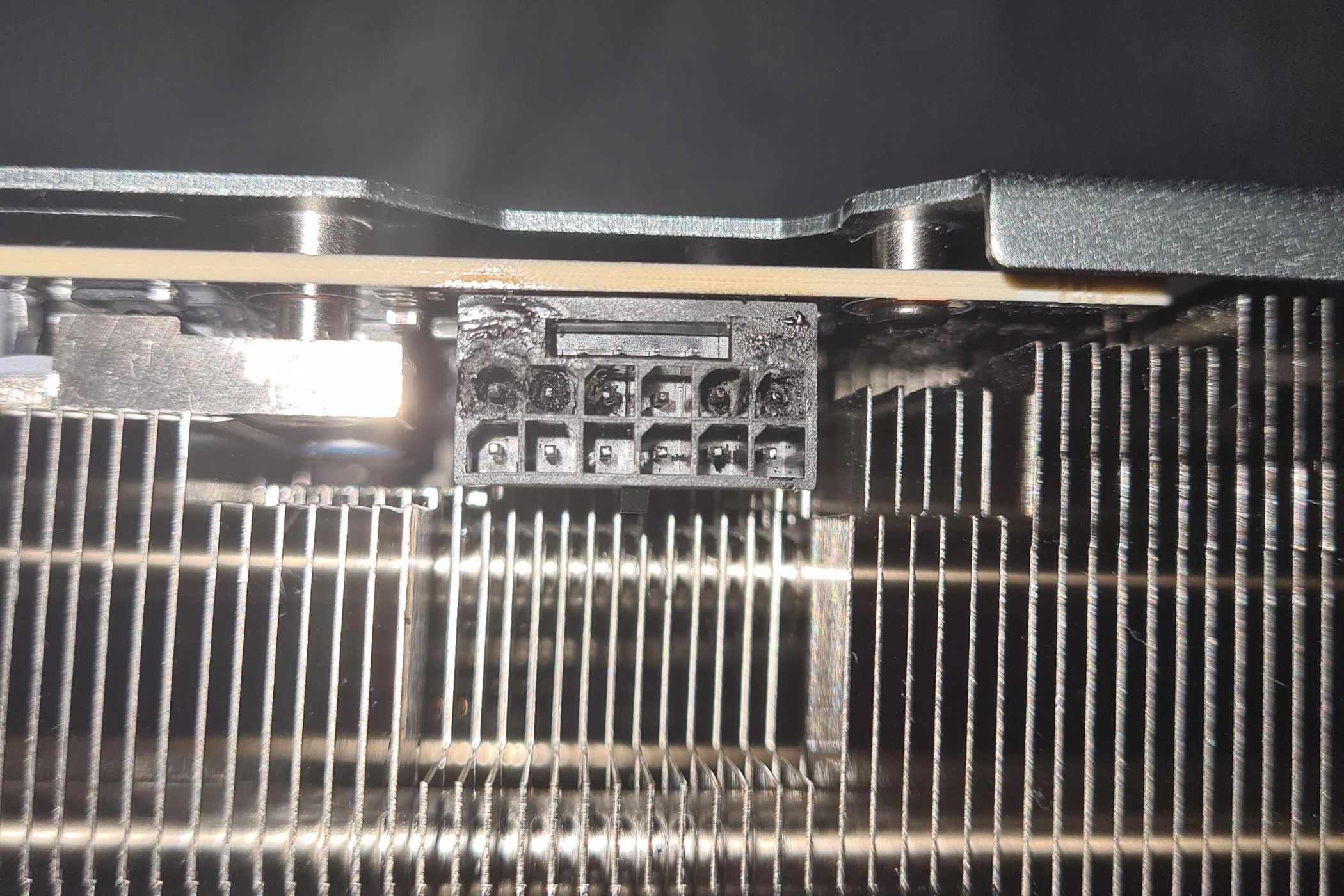 An image showing a burnt 12VHPWR connector on an RTX 4090 GPU.