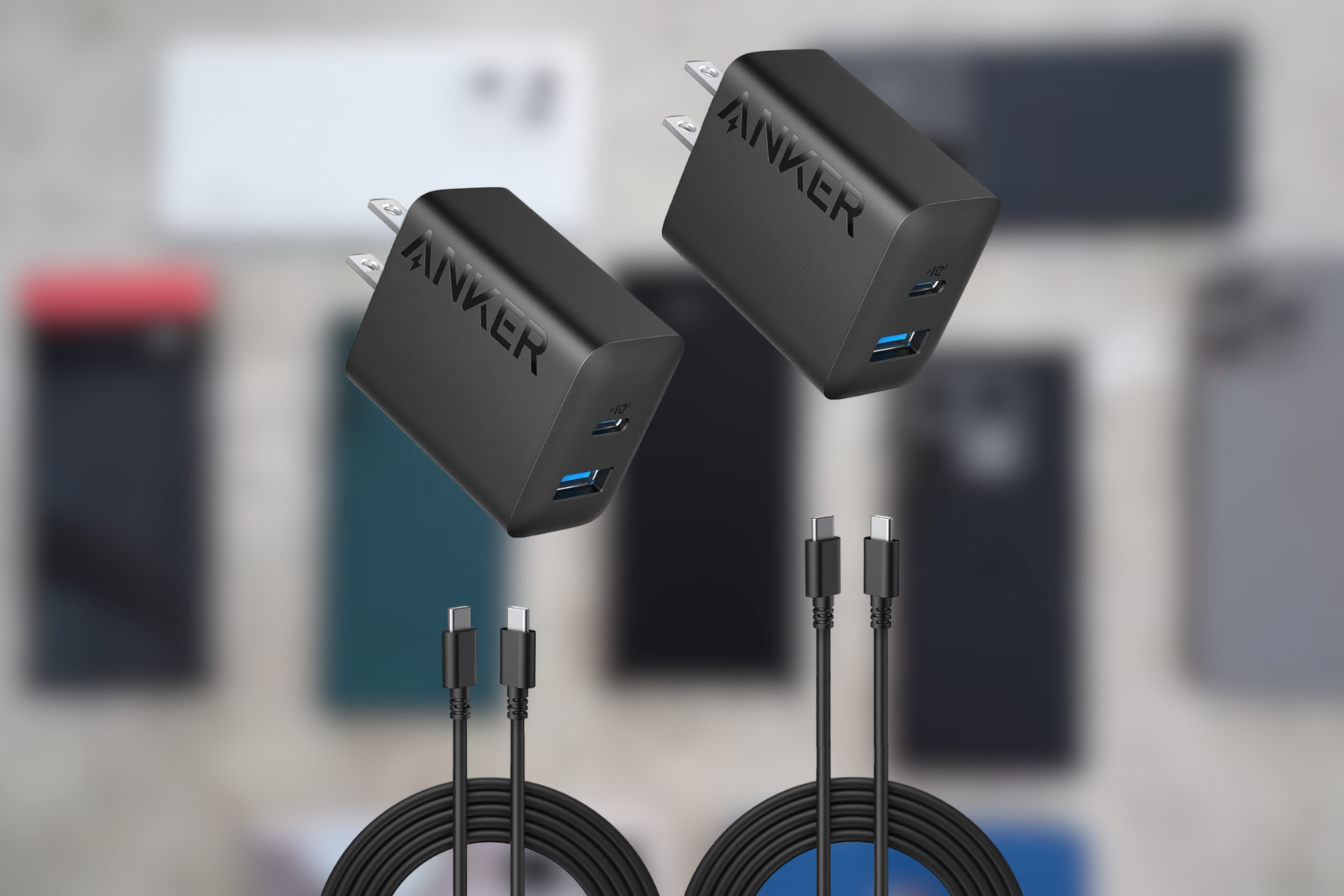 Anker USB C Charger 2-pack in front of phones