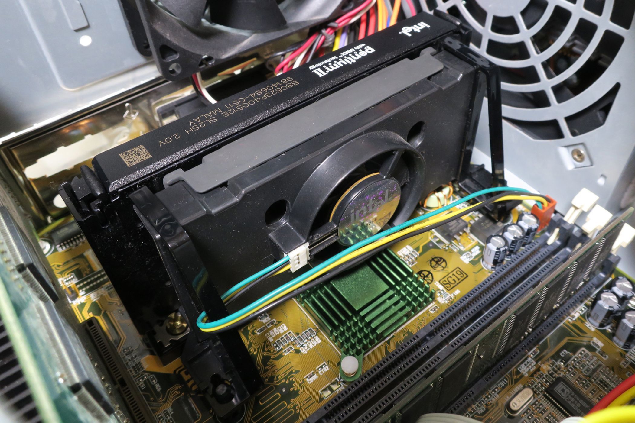 An image showing a Pentium II slot CPU form installed on a motherboard.