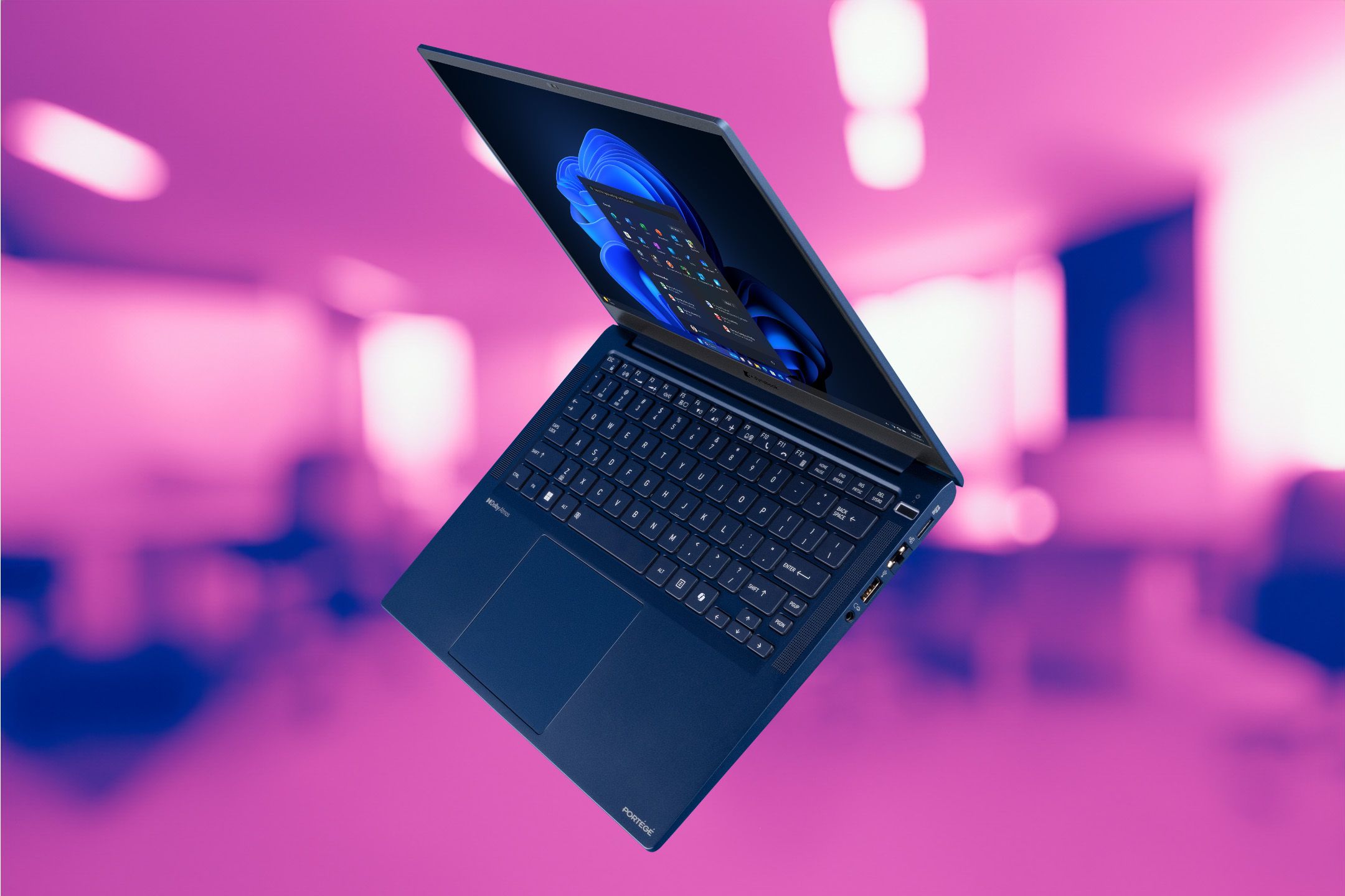 Dynabook Portege X40L-M over a pink-tinted office background