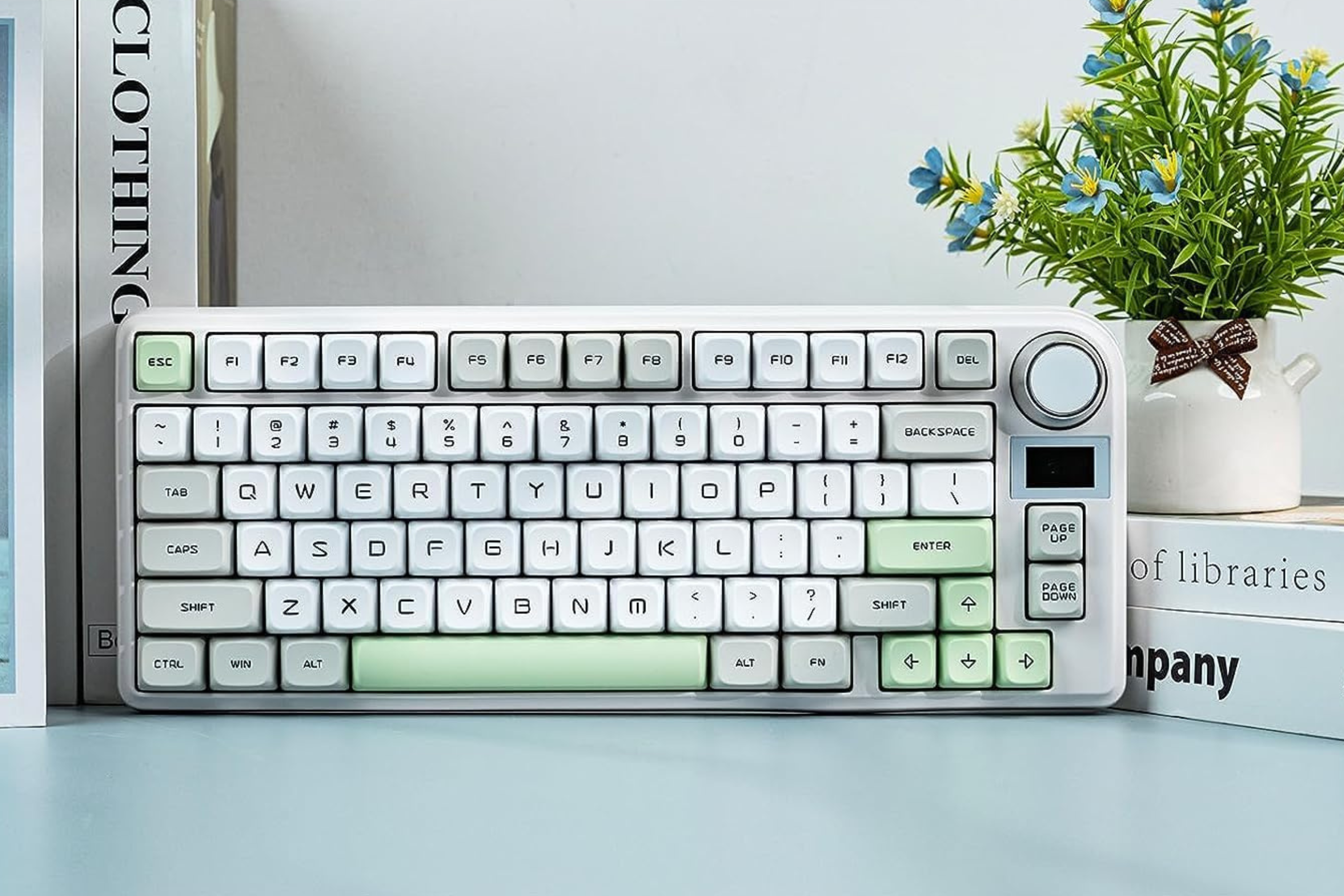 EPOMAKER TH80-X Gasket Mechanical Keyboard next to plant and books