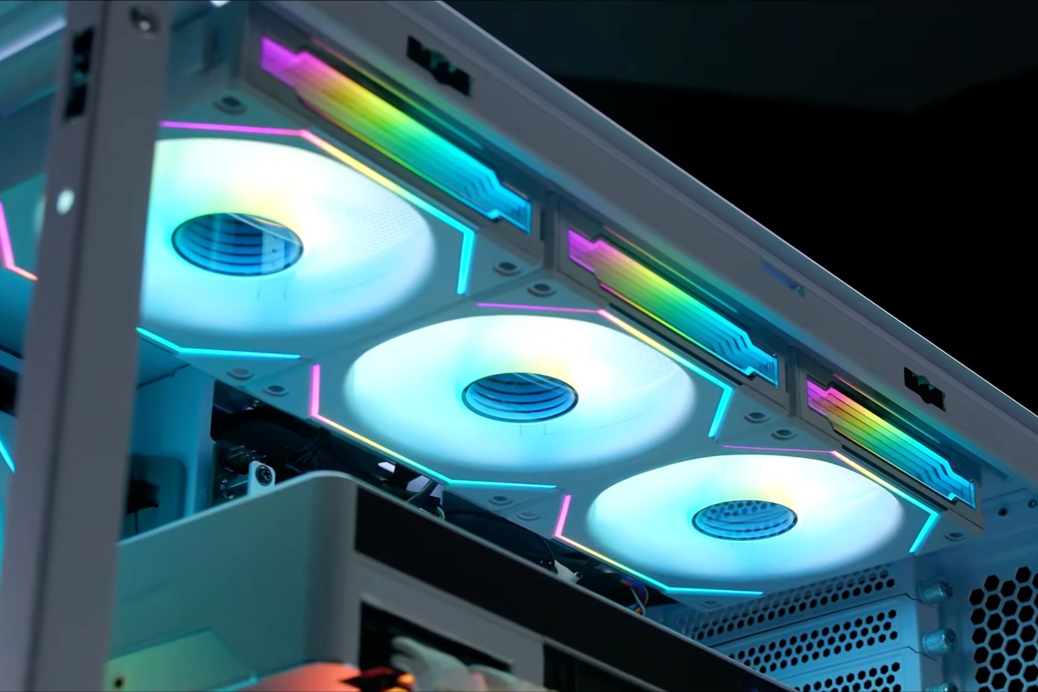 An image showing three Lian Li UNI SL-INFI120 fans installed on a PC case.
