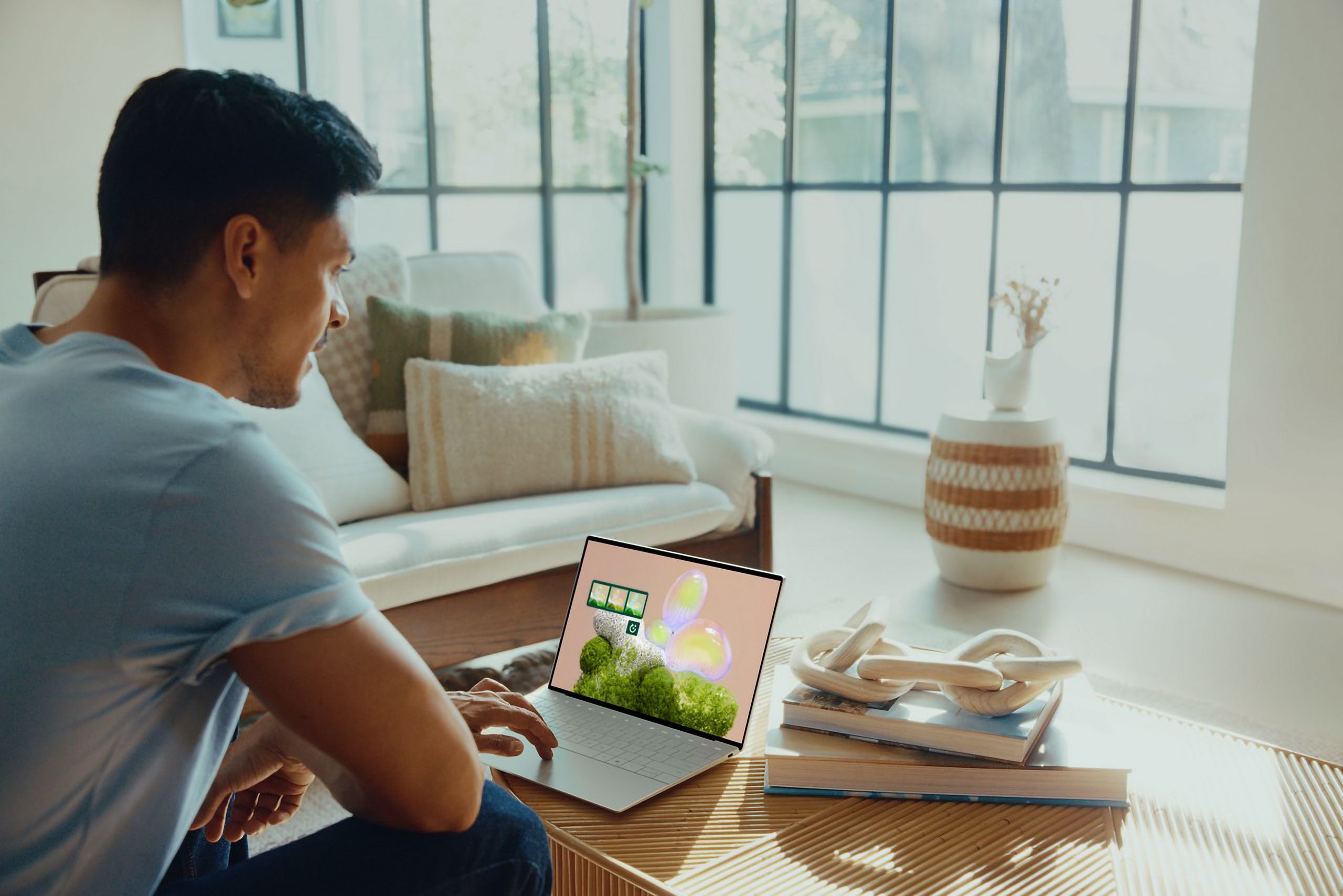 A man using a Platinum Dell XPS 13