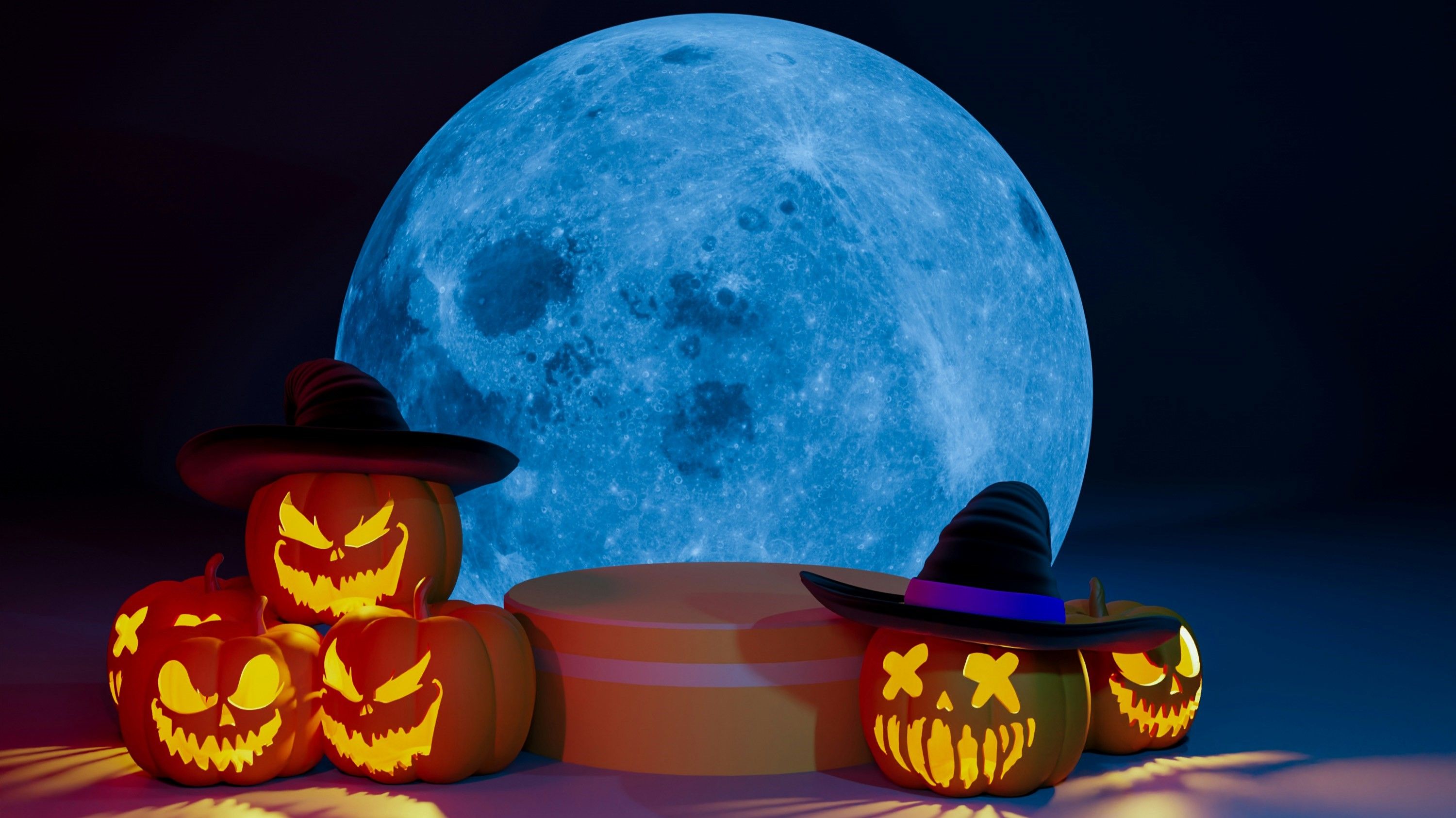 Jacko lanterns in front of a moon