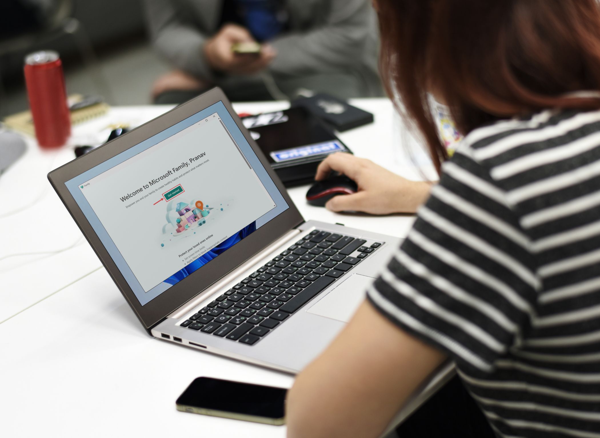 person using Windows laptop with Family app opened