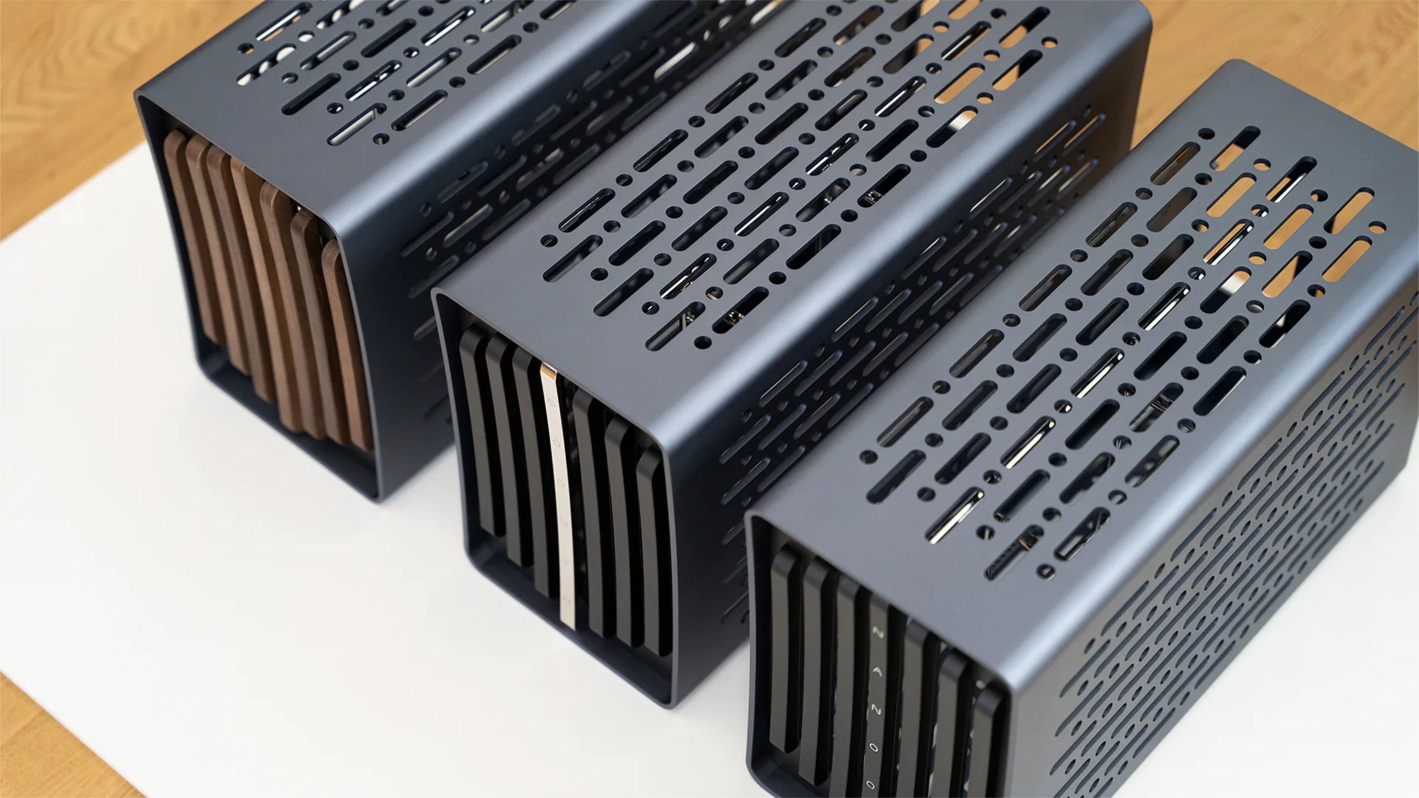 three nanoq r chassis in a row on a white table