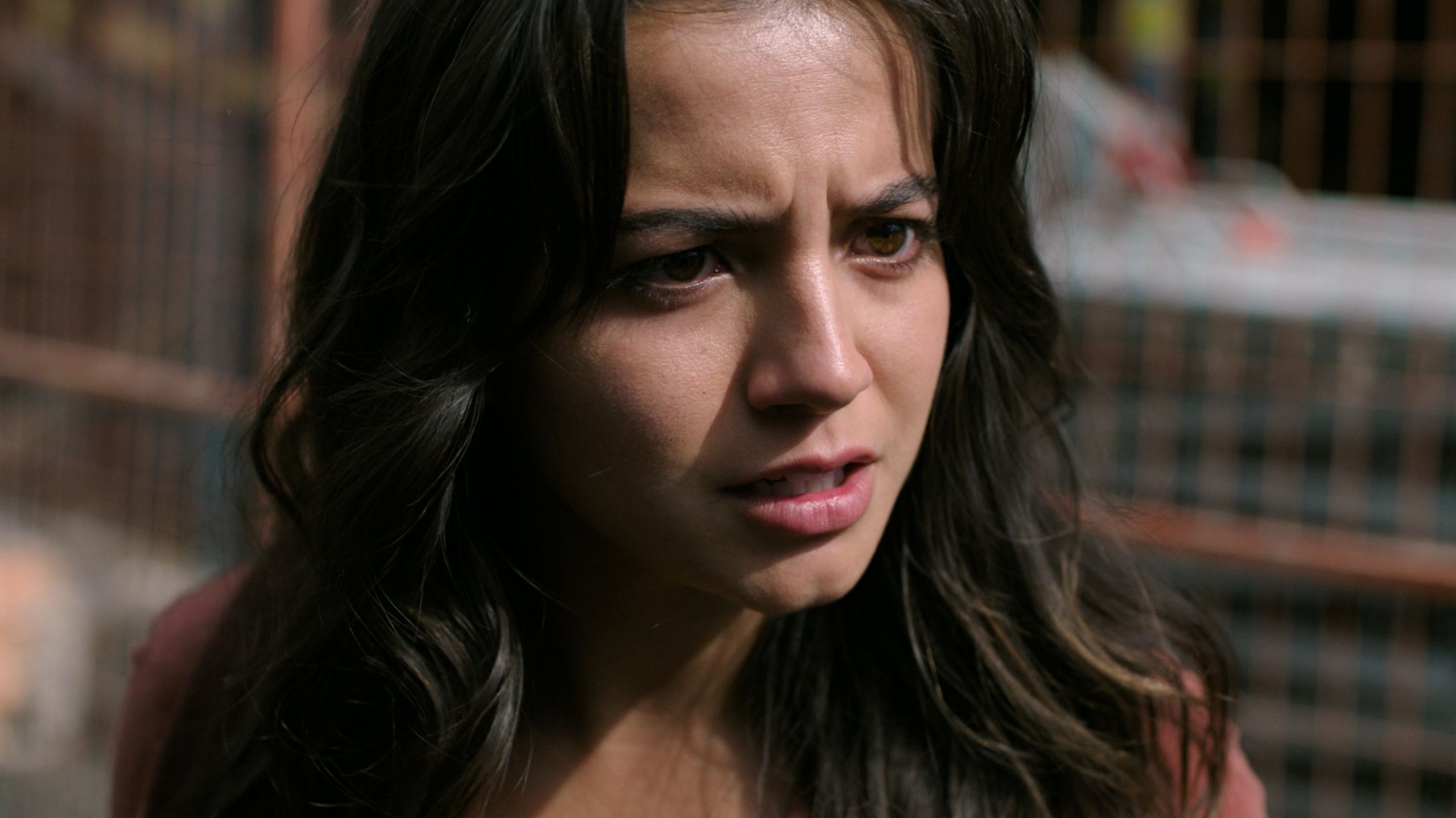 Isabela Merced as Dina looking determined in HBO's The Last of Us, season 2, episode 5.