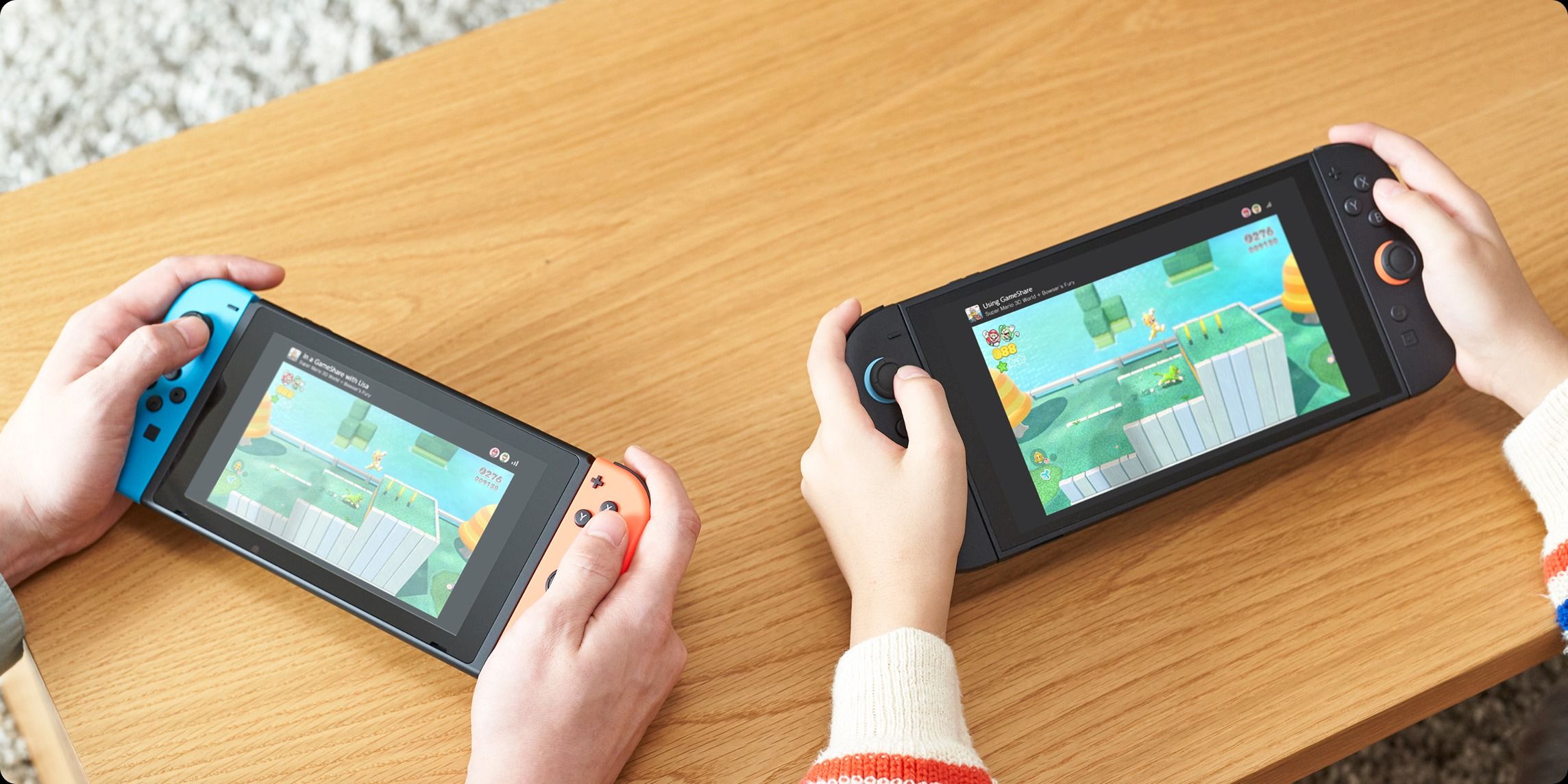A Nintendo Switch 2 and an original Nintendo Switch being used to play a multiplayer game using GameShare