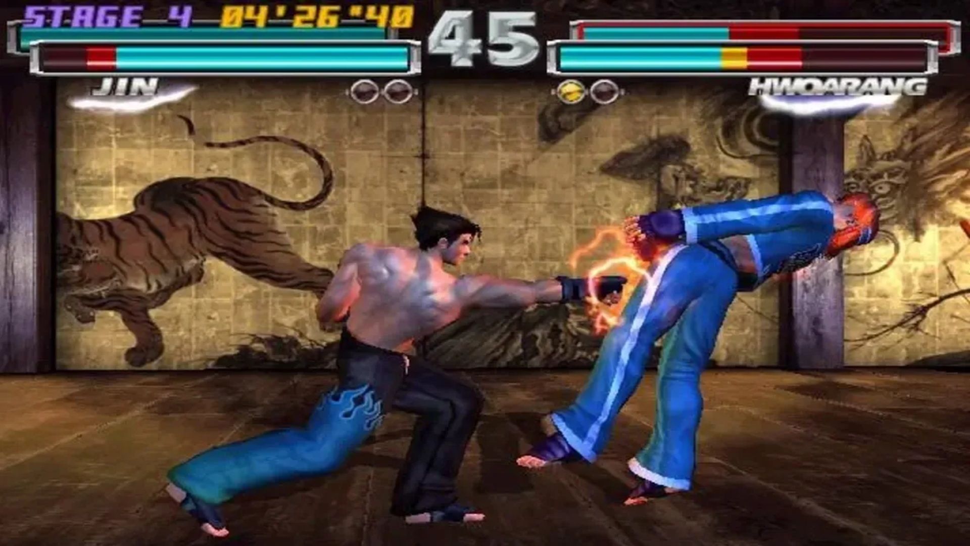 A screenshot of a match with Jin and Hwoarang in Tekken Tag Tournament