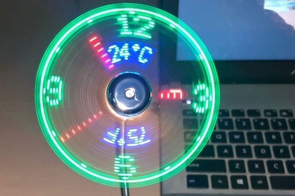 A USB fan with a green clock display