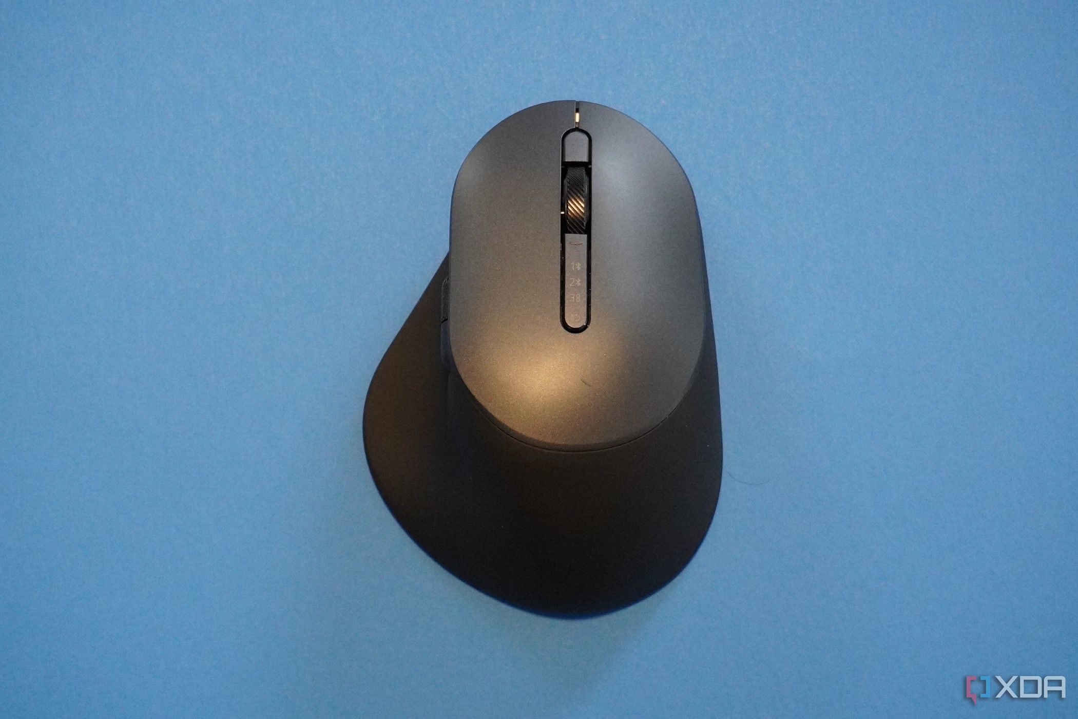 The Dell Premier Rechargable Mouse on a blue background