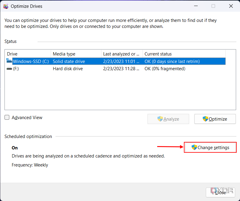 Screenshot of the Windows 11 disk optimization tool with the Change settings button highlighting