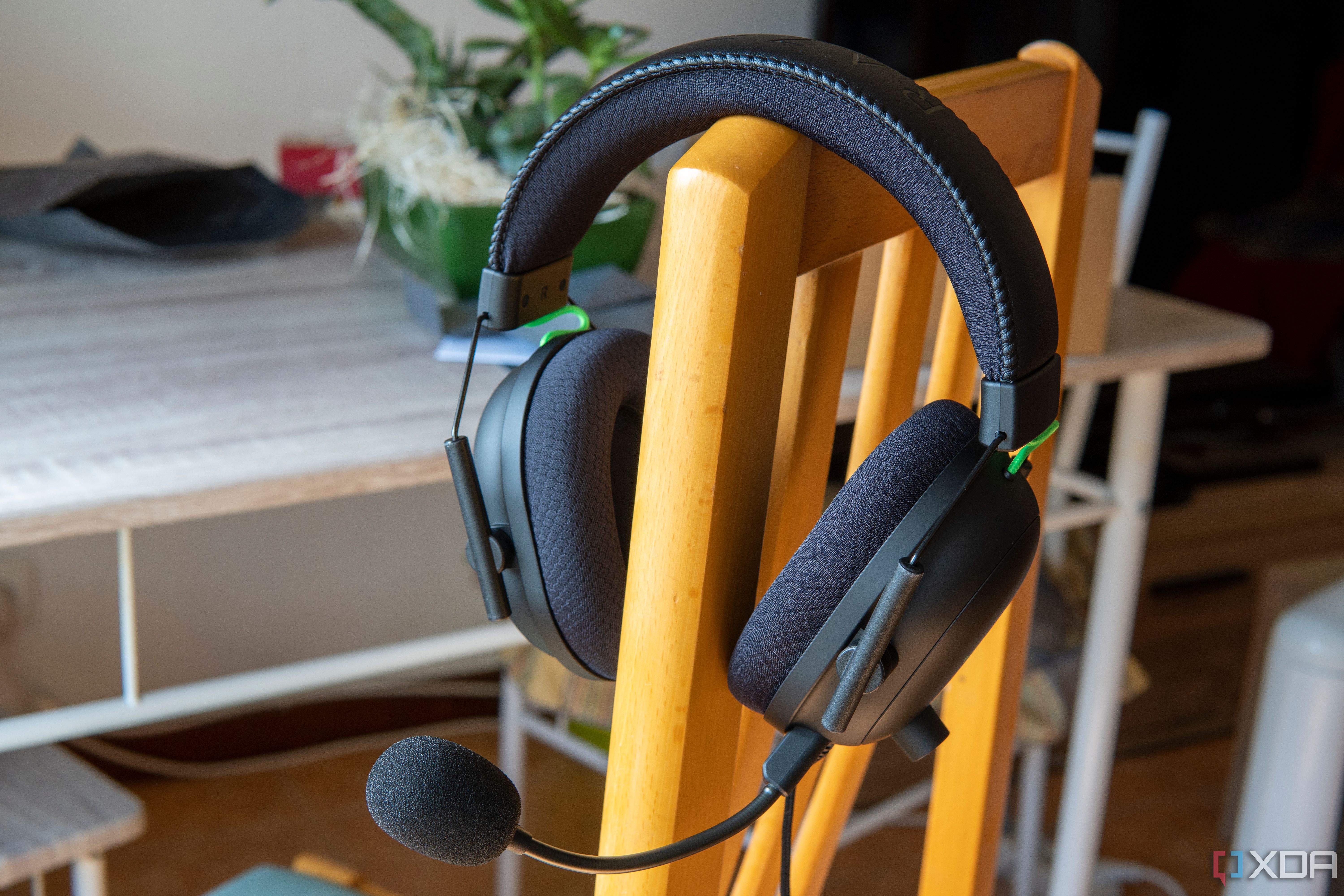 Razer BlackShark V2 headset standing on the back of a chair