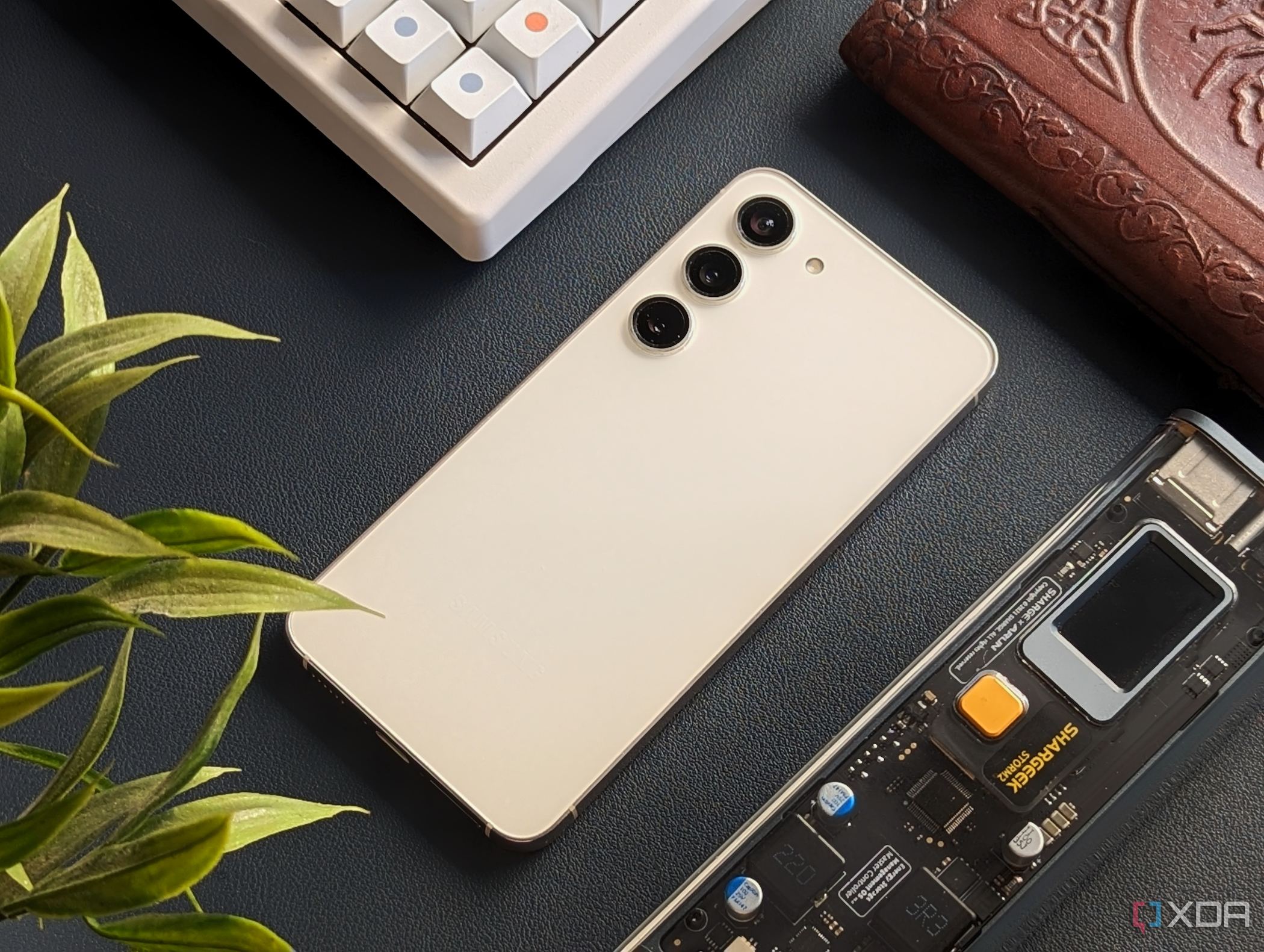 Samsung Galaxy S23 next to a keyboard.