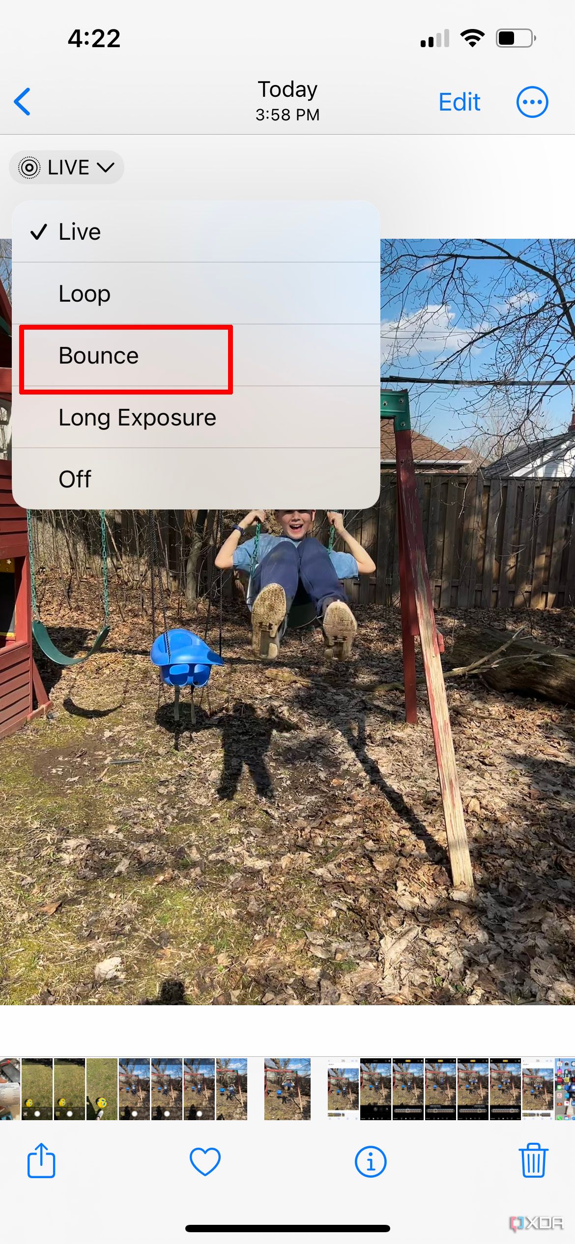 iPhone photo in frame of a young boy on a swing with the Bounce effect selected.