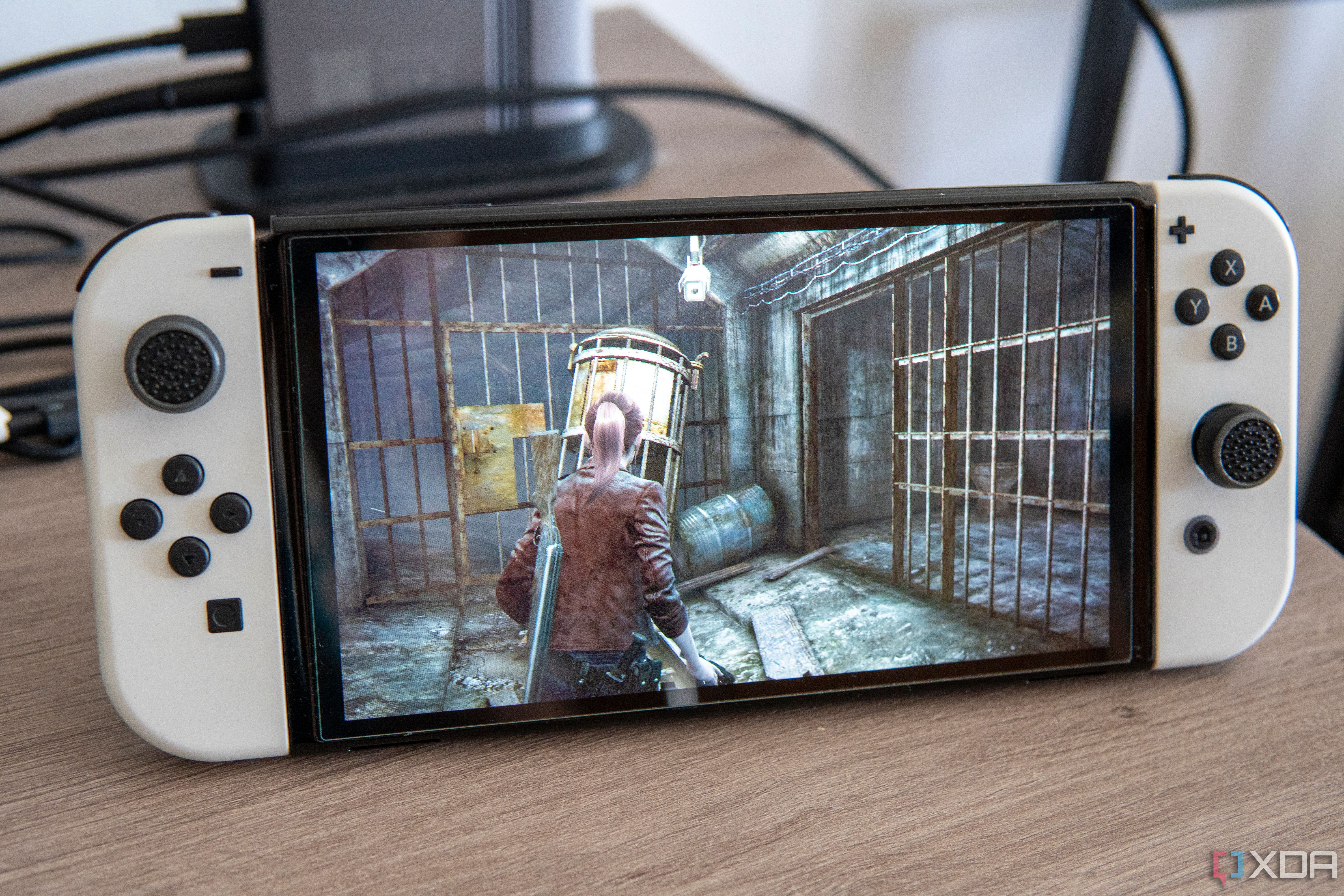 A Nintendo Switch OLED model running Resident Evil Revelations 2