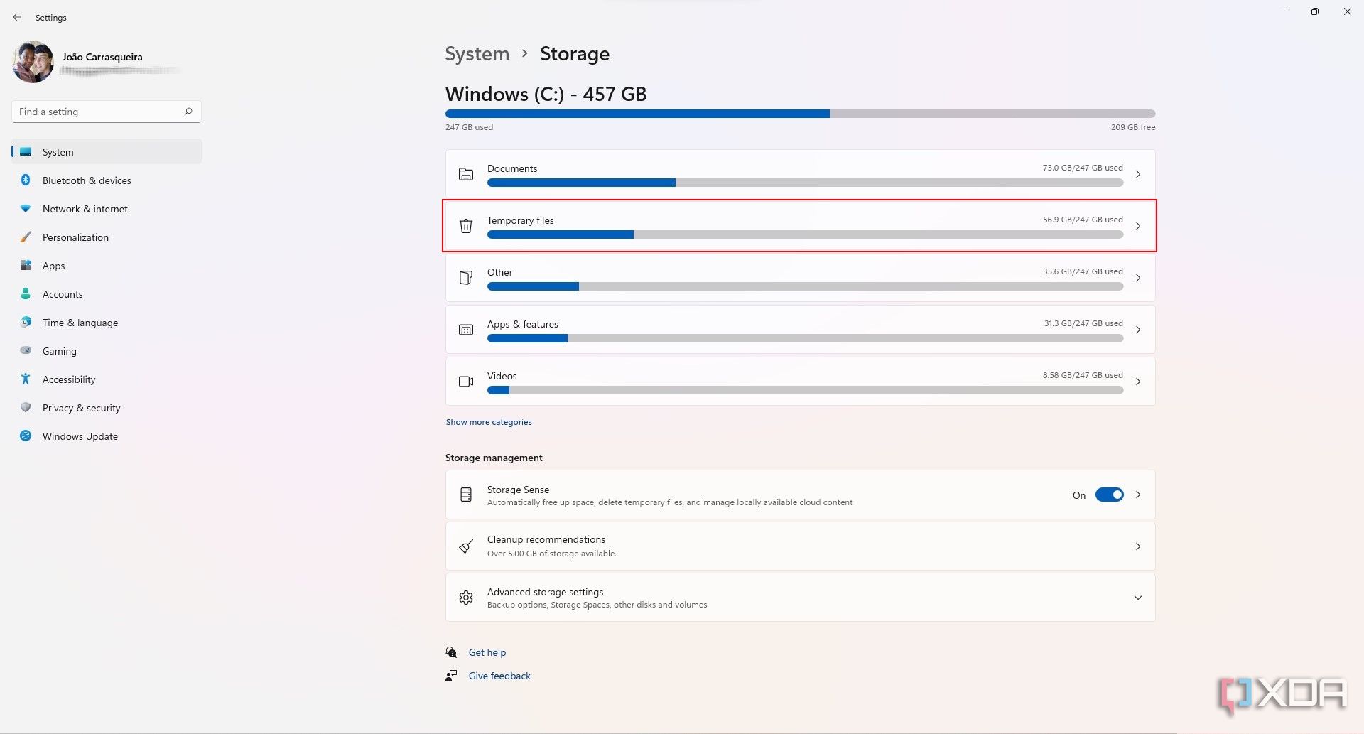 Screenshot of Windows 11 Storage settings. The temporary files button is highlighted with a red outline