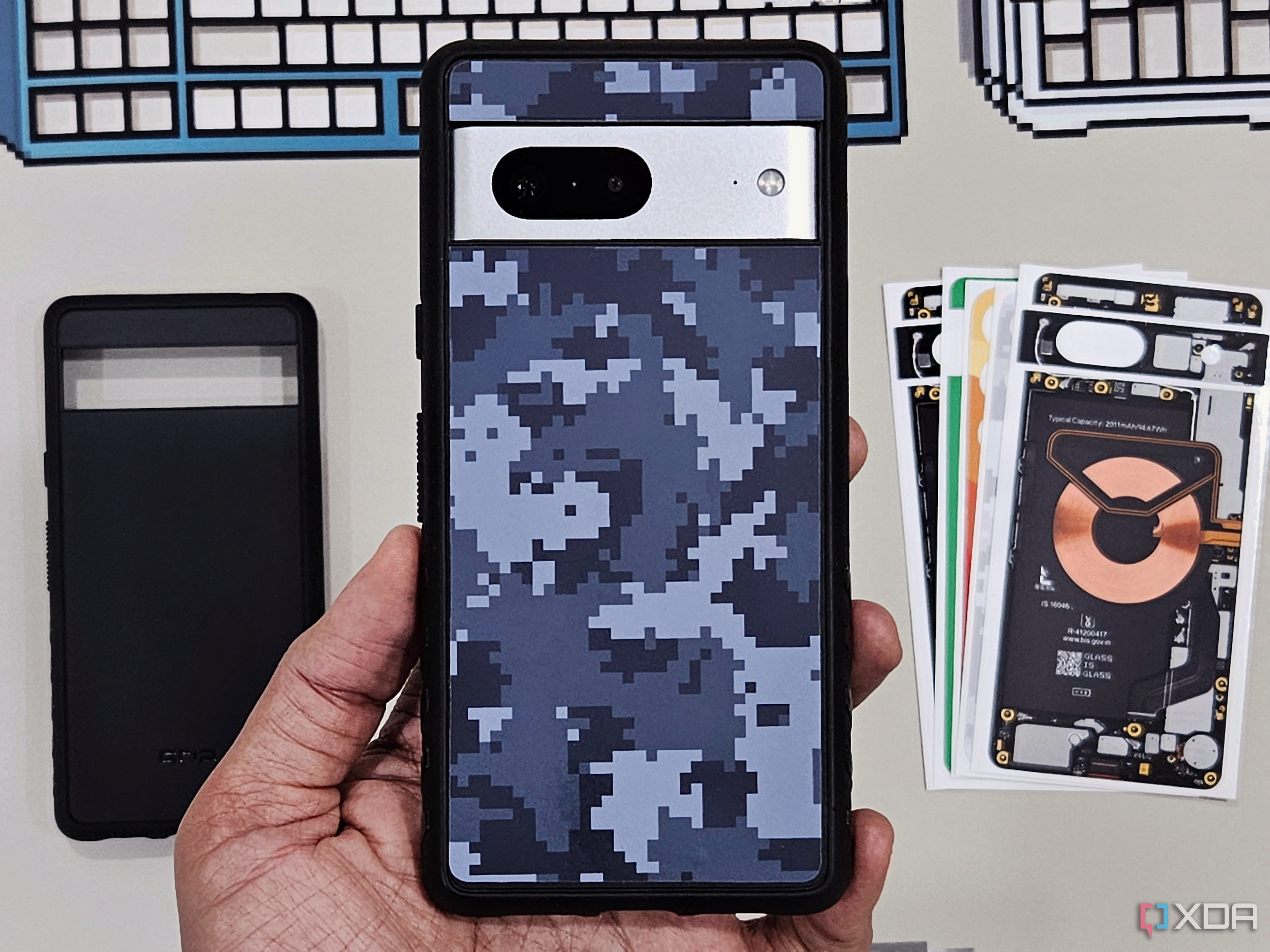 An image of a person holding a Pixel 7 with Dbrand's Grip case on it.